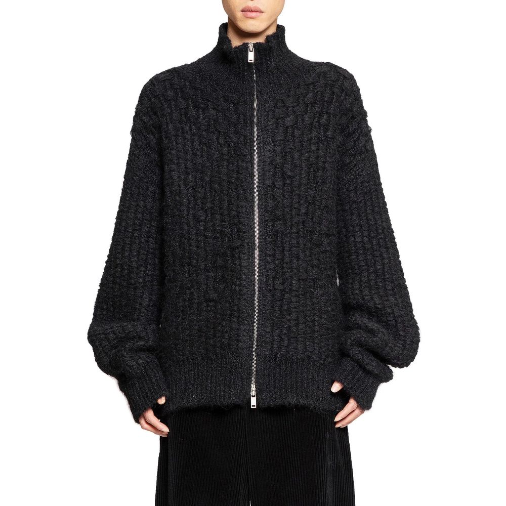 Indulge in the exquisite Jil Sander Black Alpaca Leather Cardigan, a masterpiece of luxurious alpaca and mohair, embodying timeless sophistication and Italian craftsmanship.