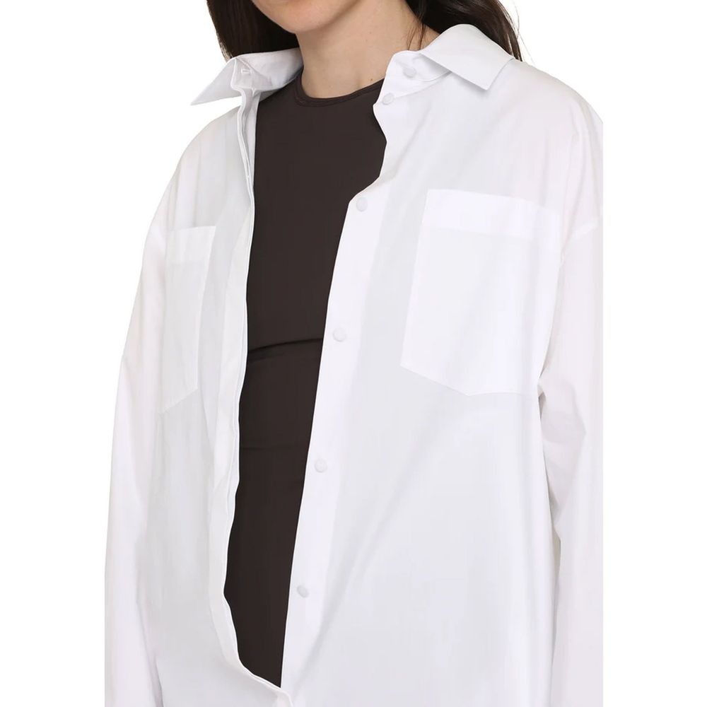 Experience the elegance of the Valentino White Cotton Casual Dress, crafted in Italy from premium materials, embodying luxury and sophistication for every occasion.