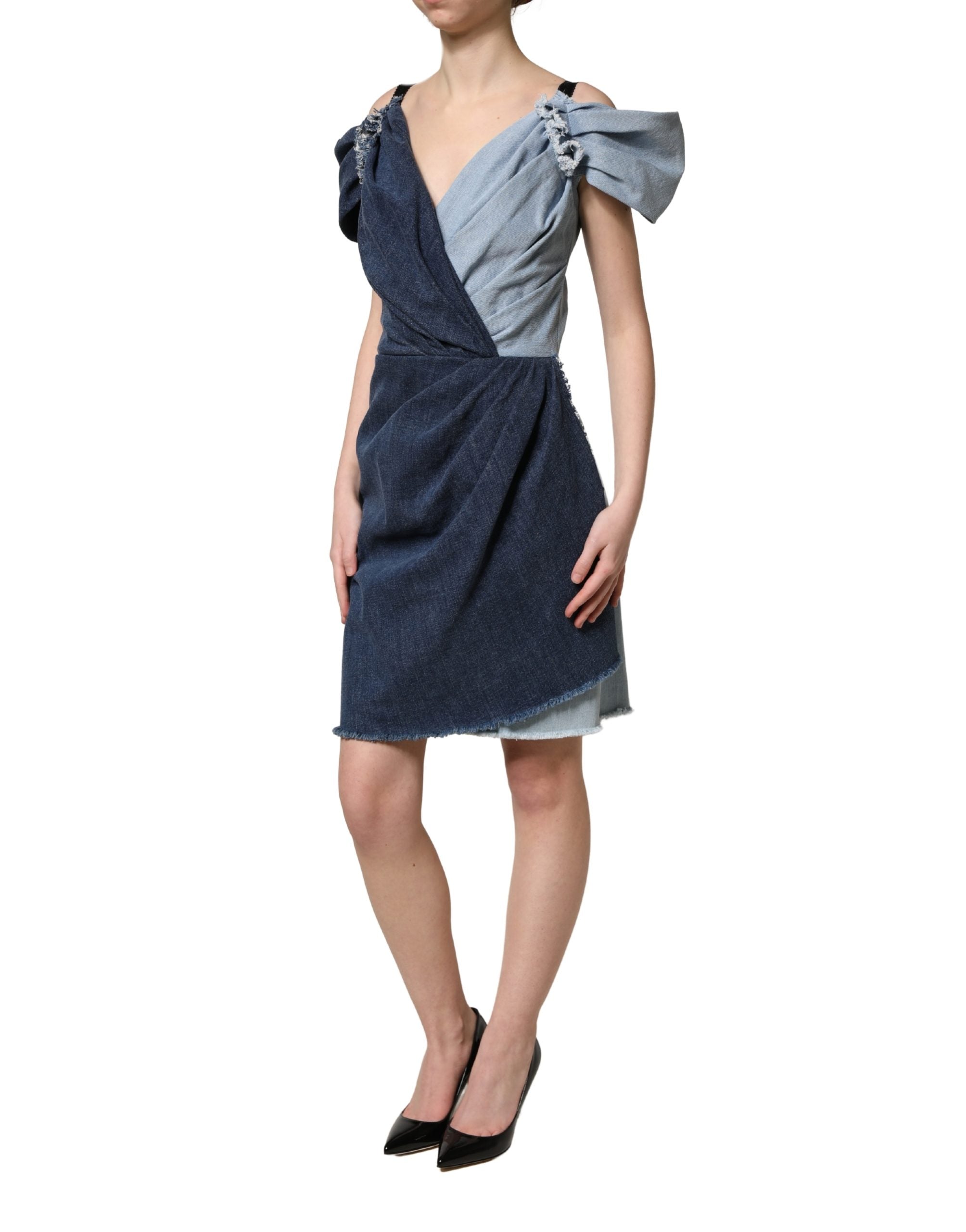 Indulge in the exquisite Dolce & Gabbana Blue Cotton Patchwork Denim Mini Sheath Dress, a masterpiece of Italian craftsmanship that embodies sophistication and allure.
