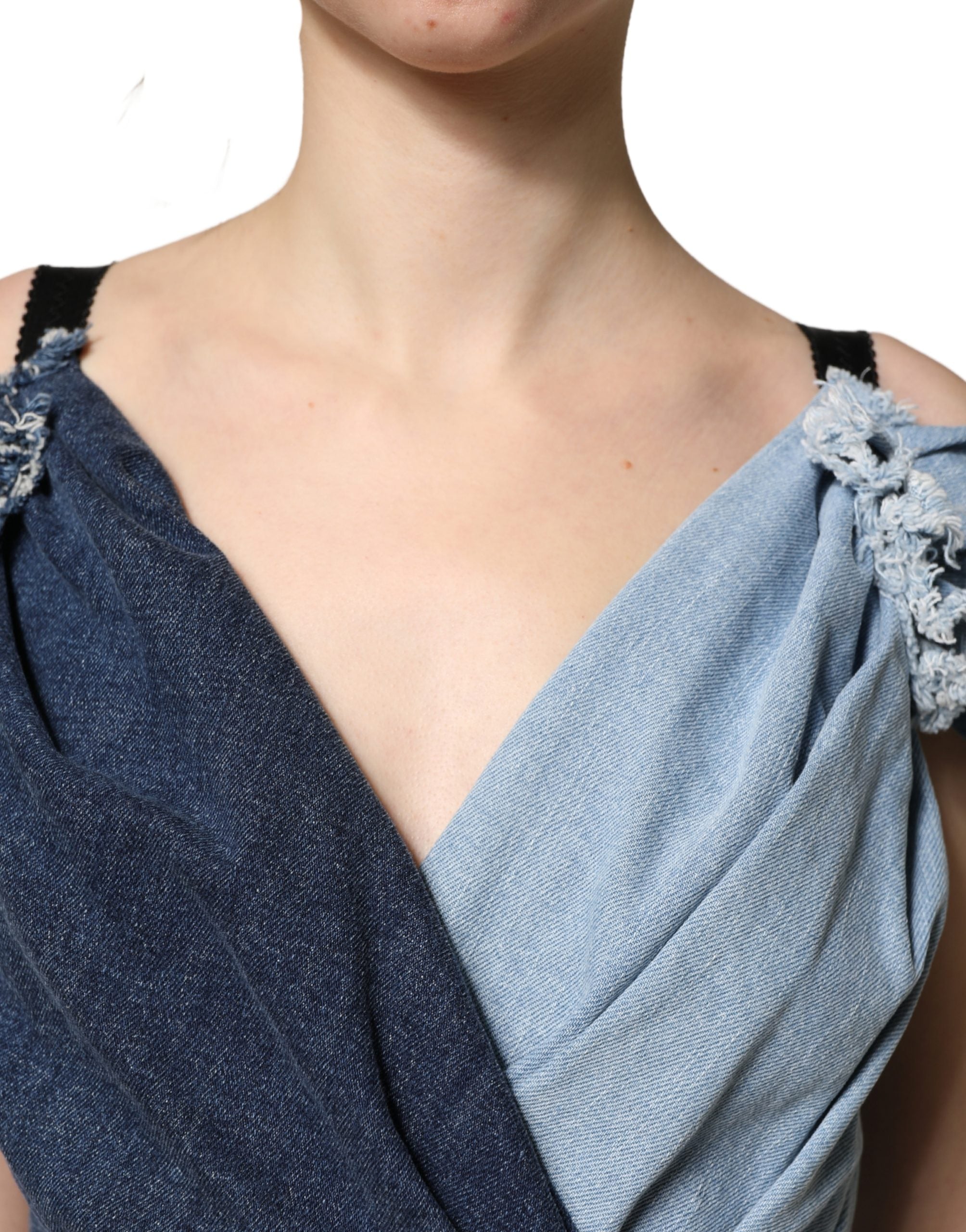 Indulge in the allure of Dolce & Gabbana's Blue Cotton Patchwork Denim Mini Sheath Dress, a masterpiece of Italian craftsmanship that embodies sophistication and timeless elegance.