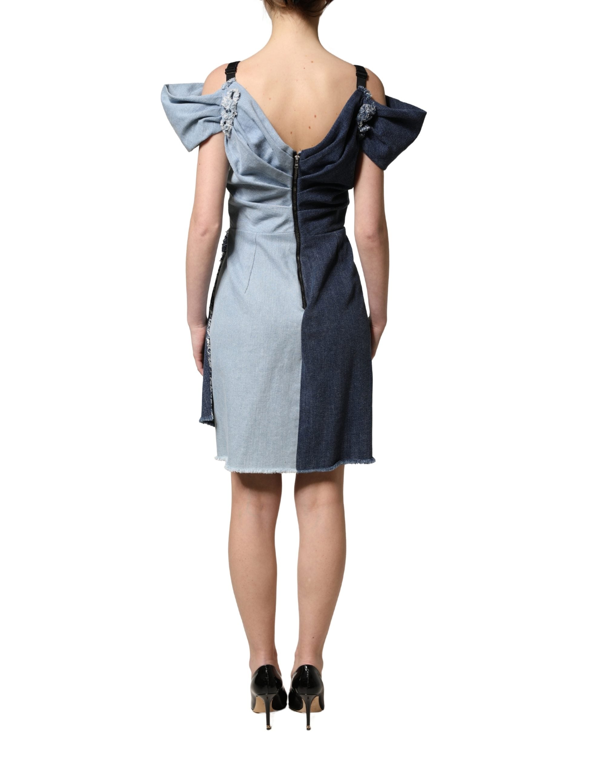 Indulge in the exquisite allure of the Dolce & Gabbana Blue Cotton Patchwork Denim Mini Sheath Dress, a masterpiece of Italian craftsmanship that embodies luxury and sophistication.