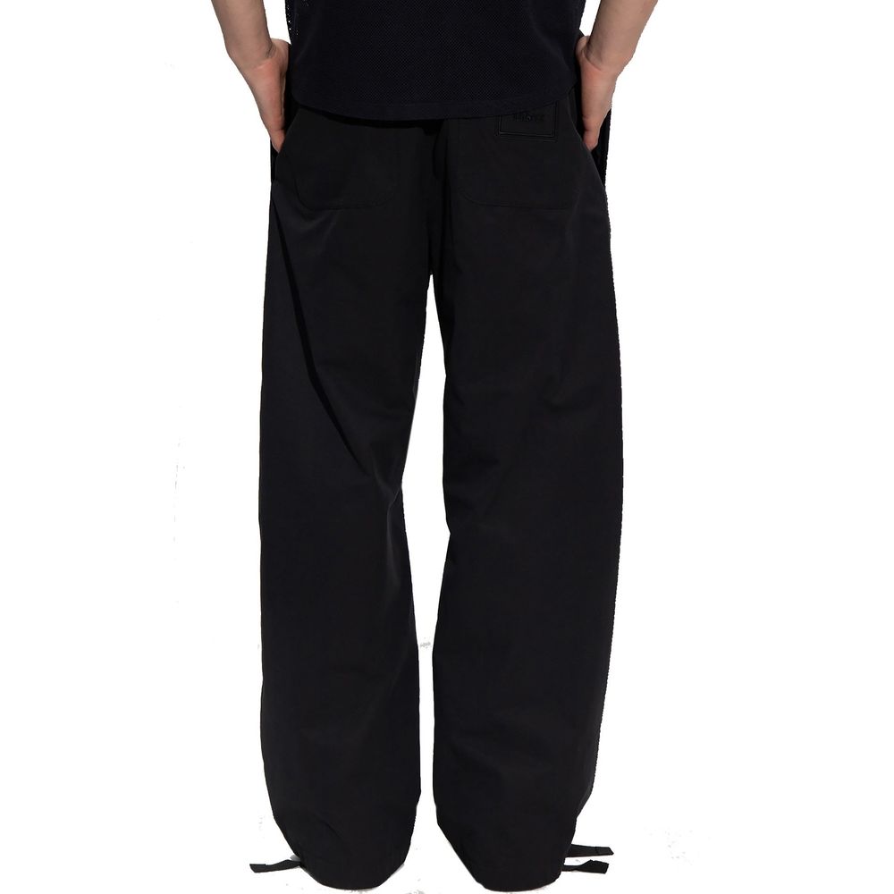 Experience the allure of Versace's Black Cotton Casual Pants, a testament to luxury and sophistication, crafted for those who embody elegance and confidence.