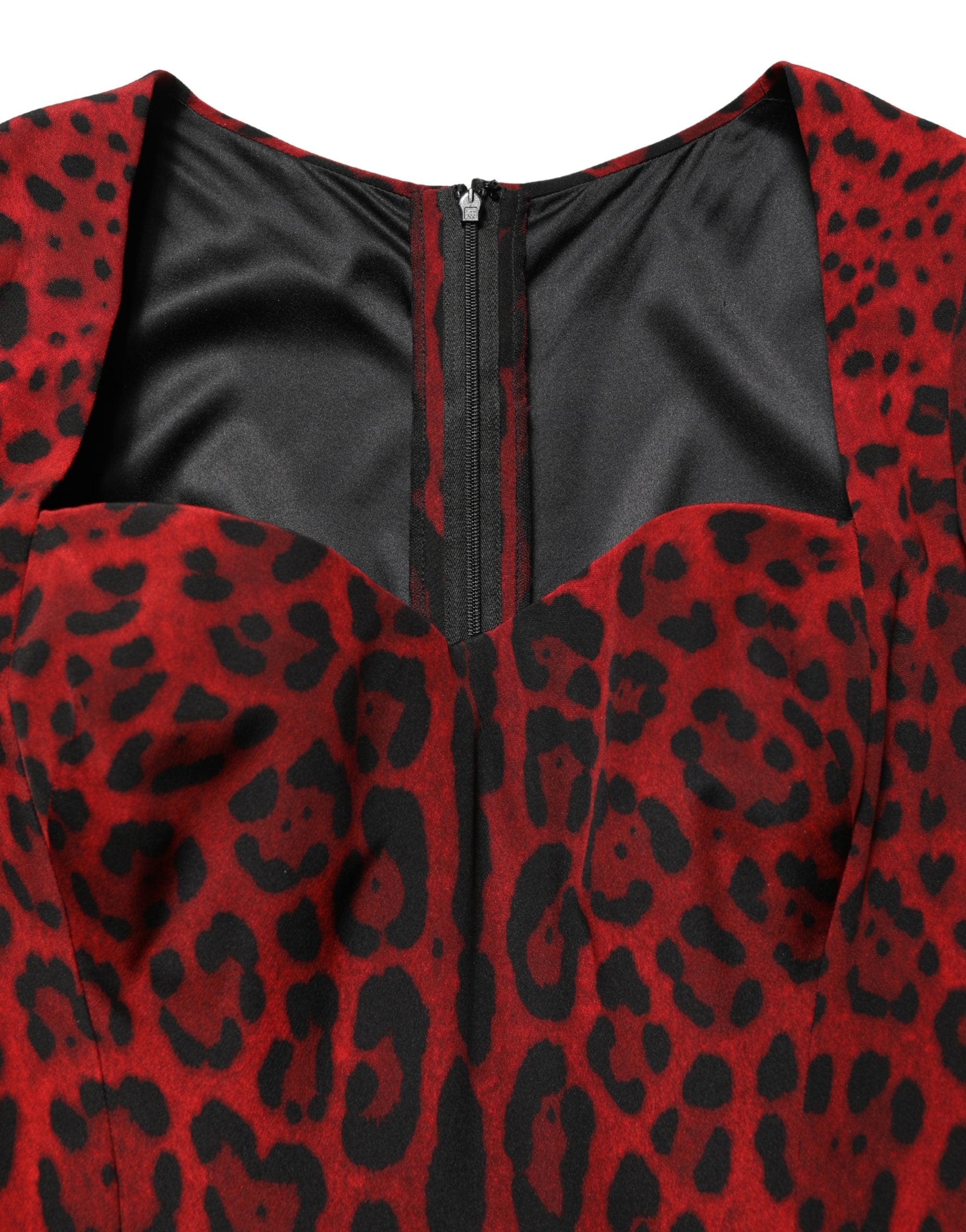 Elevate your wardrobe with the Dolce & Gabbana red leopard print sheath dress, a luxurious silk masterpiece that embodies Italian craftsmanship and sophisticated allure.
