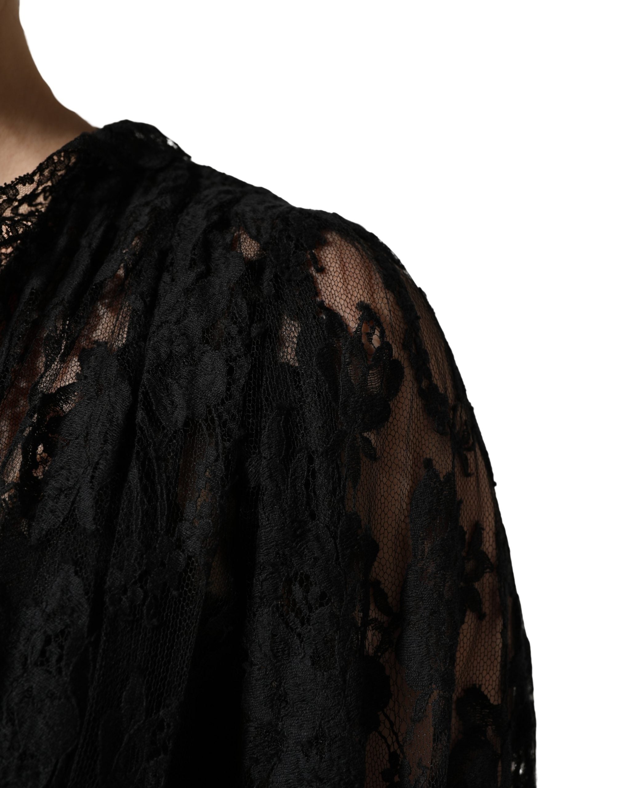 Indulge in the exquisite allure of the Dolce & Gabbana Black Lace A-line Evening Gown, a masterpiece of Italian craftsmanship that embodies timeless elegance and sophistication.