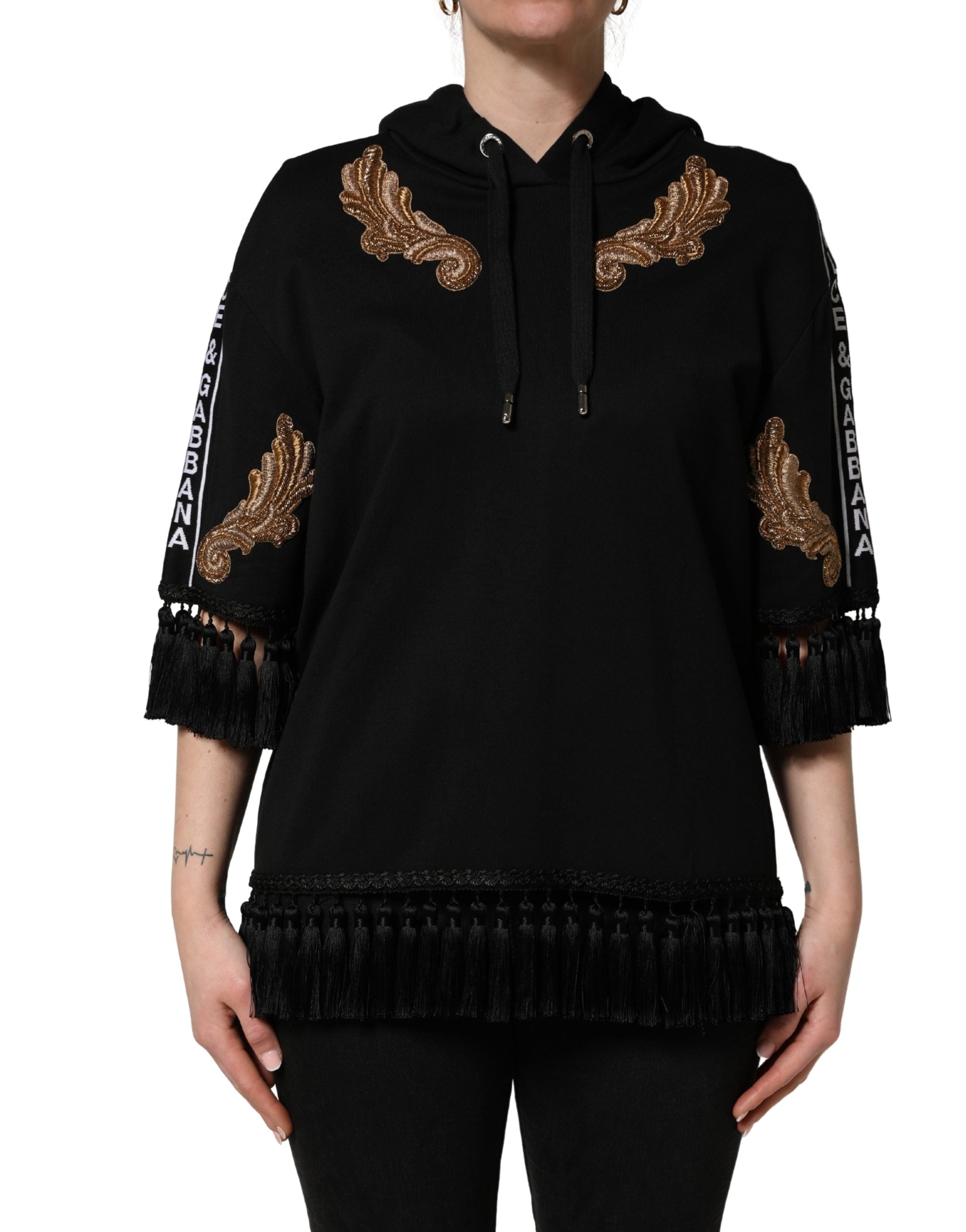 Elevate your wardrobe with the Dolce & Gabbana Black Embroidered Tassel Hooded Sweatshirt, a masterpiece of Italian craftsmanship that embodies luxury and sophistication.