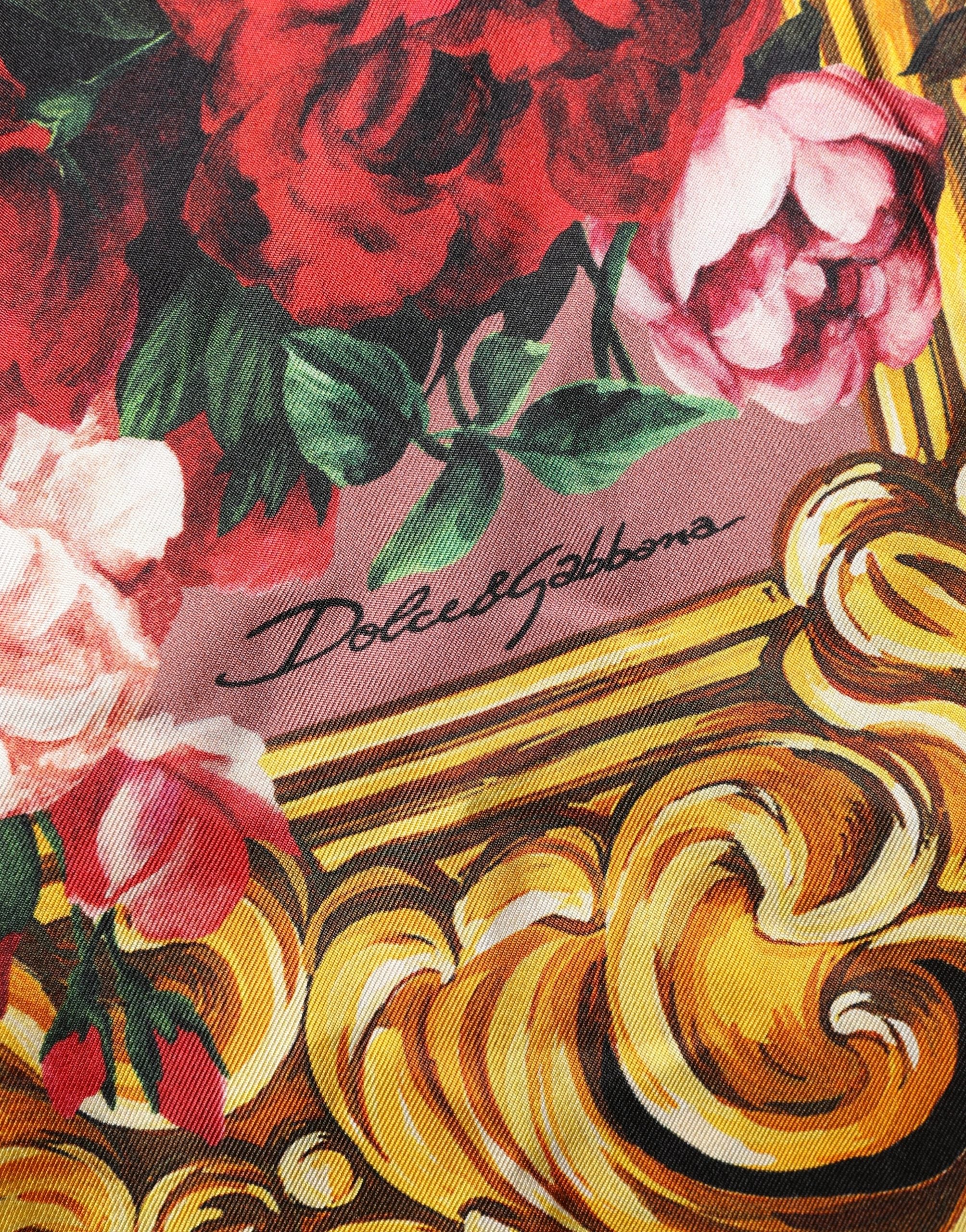 Indulge in the exquisite allure of Dolce & Gabbana's floral silk shirt, a luxurious statement piece that embodies elegance and sophistication for the discerning individual.
