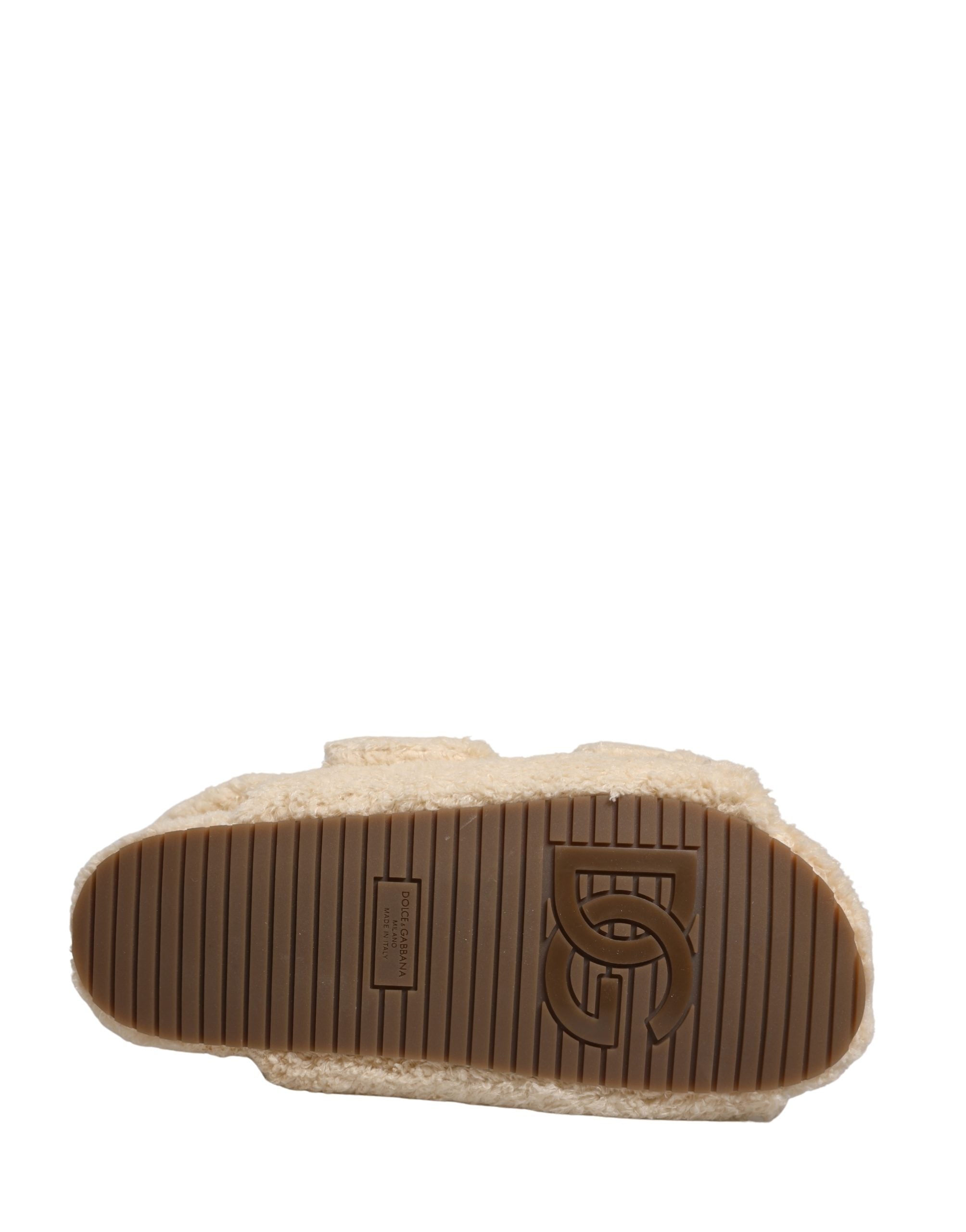 Elevate your style with Dolce & Gabbana's Beige Faux Fur Slides, where luxurious comfort meets exquisite craftsmanship, perfect for the discerning individual.