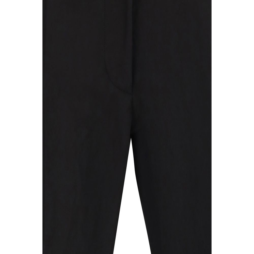 Elevate your wardrobe with Max Mara's Black Viscose Flared Pants, a masterpiece of luxurious design and exquisite craftsmanship, perfect for any sophisticated occasion.