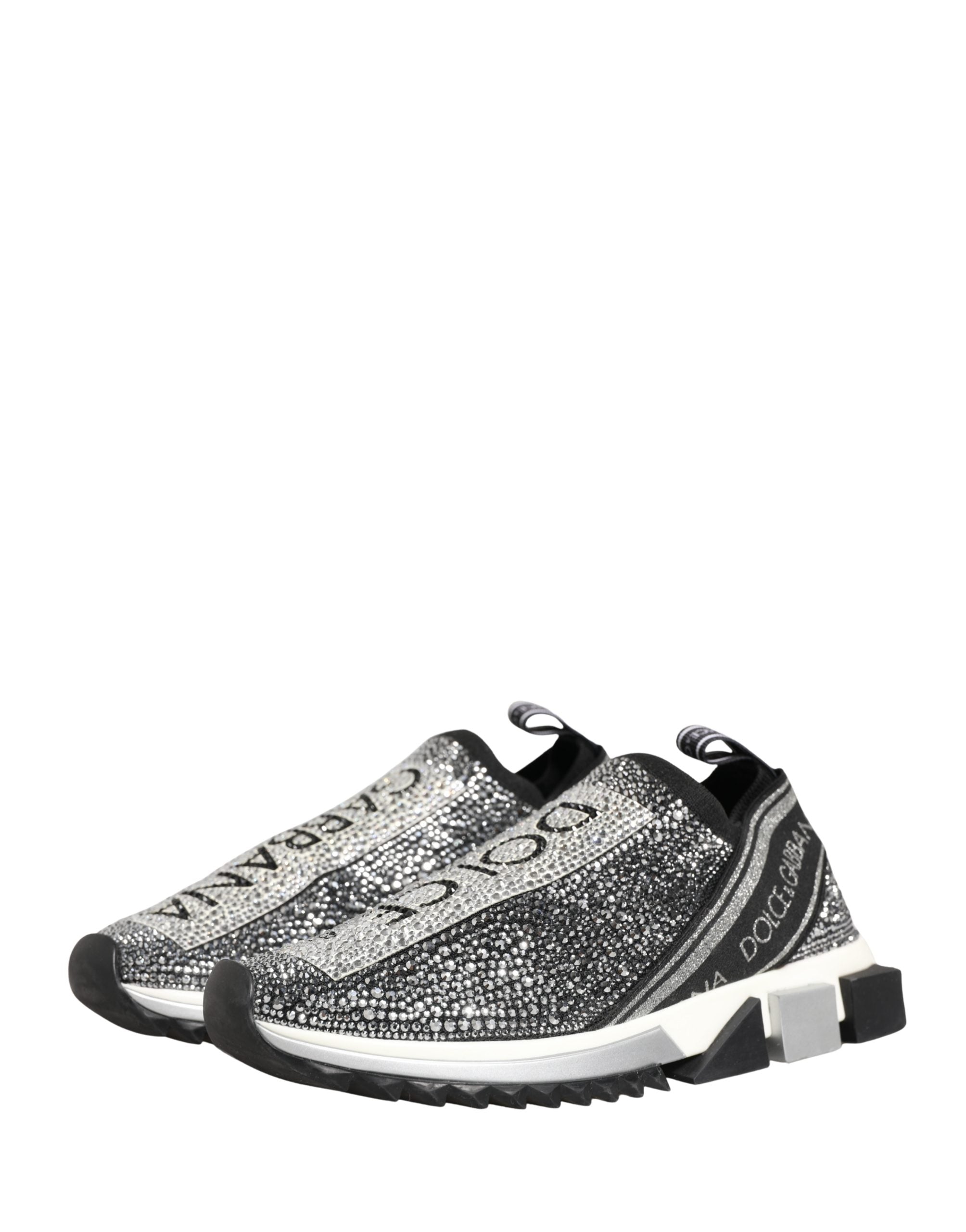 Elevate your style with Dolce & Gabbana's Silver Crystal Logo Slip On Sorrento Sneakers, where Italian craftsmanship meets luxurious comfort in a striking black and silver design.