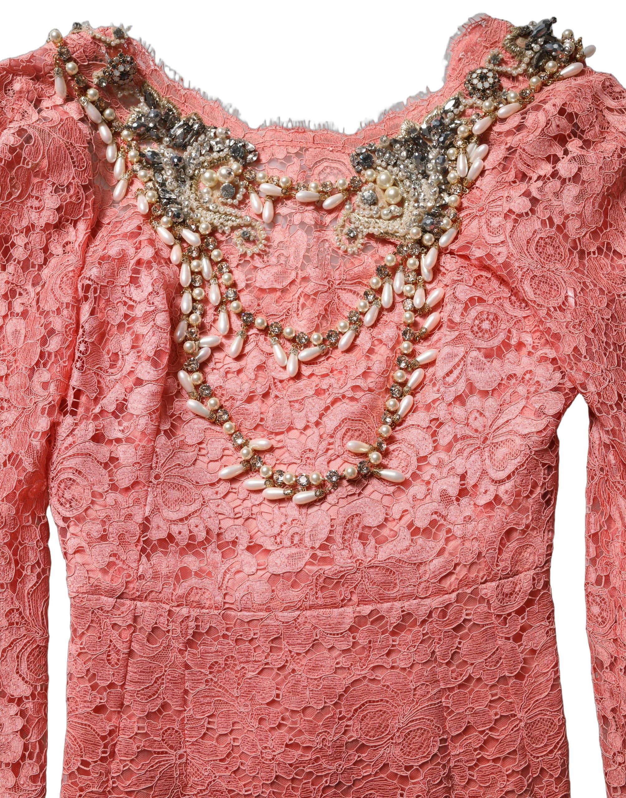 Indulge in the allure of the Dolce & Gabbana Pink Embellished Mermaid Lace Gown, a masterpiece of Italian craftsmanship, perfect for unforgettable evenings.