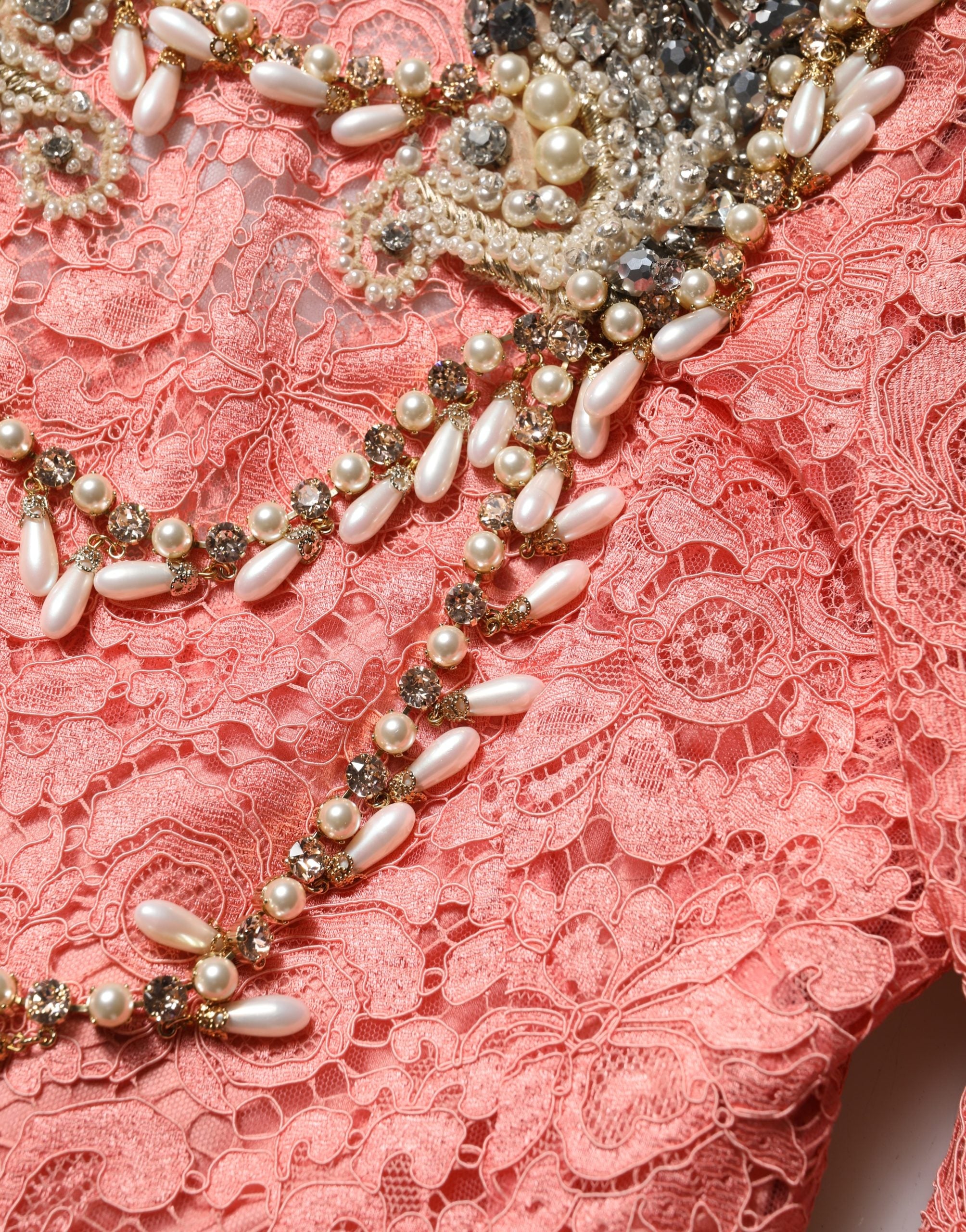 Indulge in the allure of the Dolce & Gabbana Pink Embellished Mermaid Lace Gown, a masterpiece of exquisite craftsmanship and luxurious materials, perfect for unforgettable evenings.