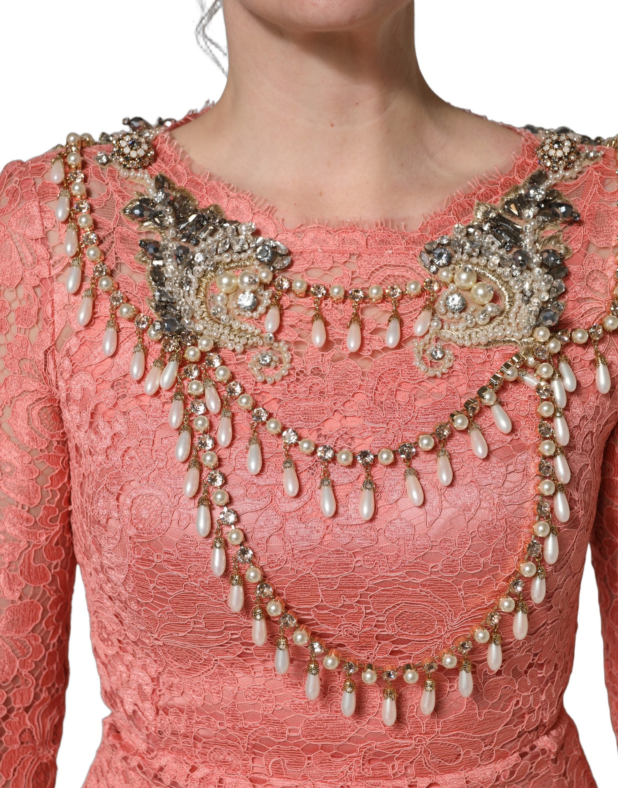 Indulge in the allure of the Dolce & Gabbana Pink Embellished Mermaid Lace Gown, a masterpiece of Italian craftsmanship, perfect for unforgettable evenings.