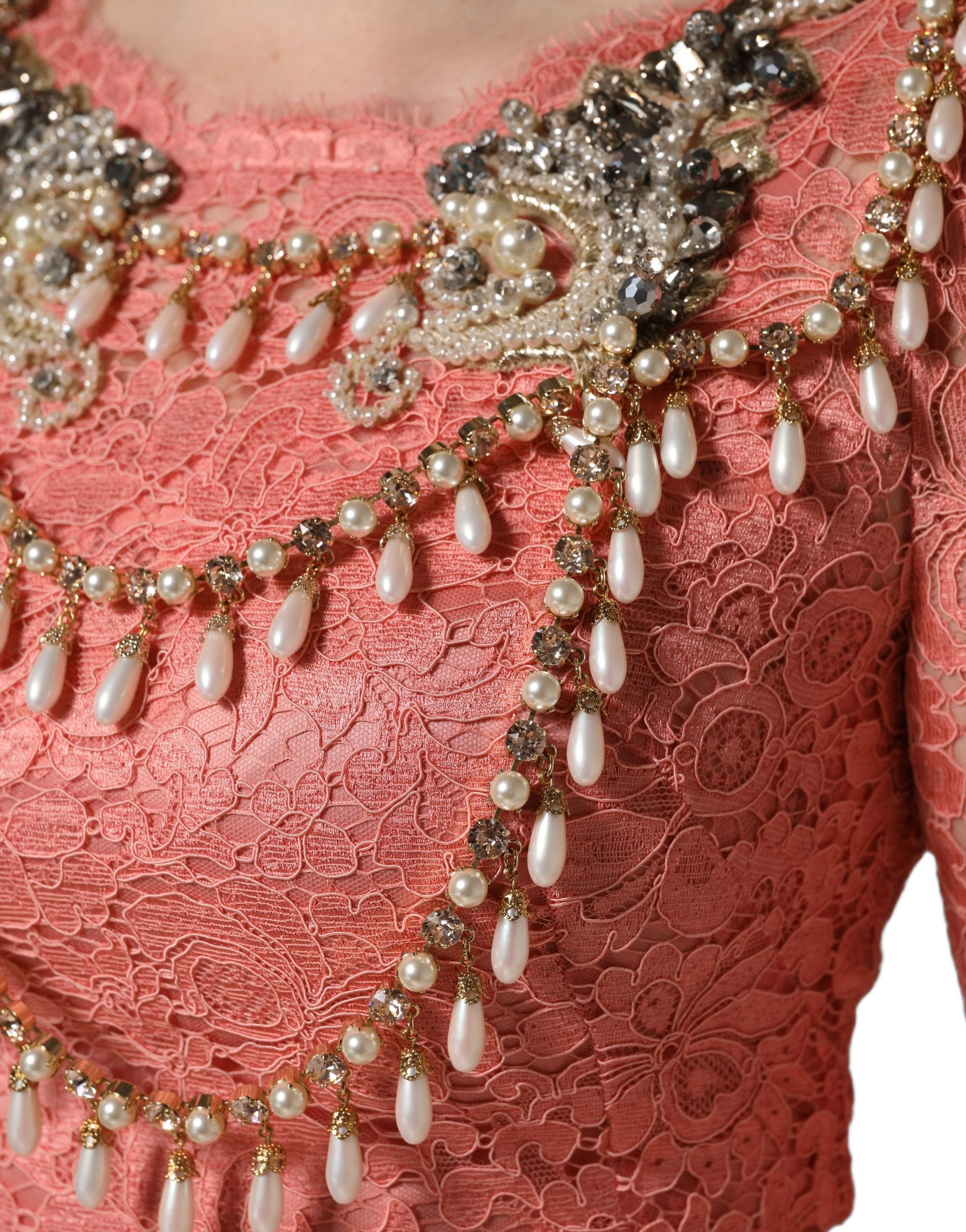 Indulge in the exquisite Dolce & Gabbana Pink Embellished Mermaid Lace Gown, a masterpiece of Italian craftsmanship that embodies elegance and allure for any formal occasion.
