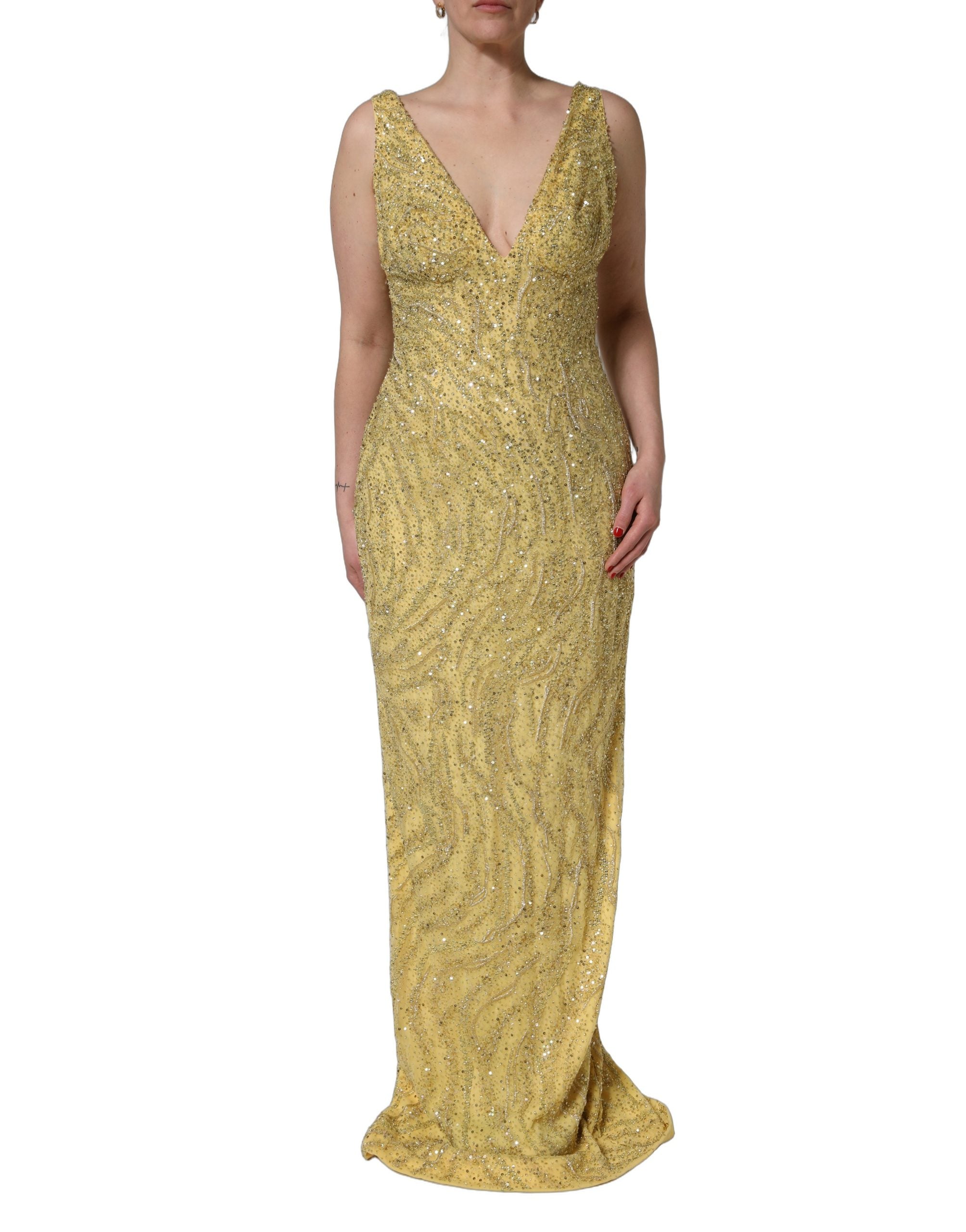 Indulge in the exquisite Dolce & Gabbana Gold V-neckline Mermaid Sequinned Gown, a masterpiece of silk and glass that embodies luxury and elegance for unforgettable evenings.