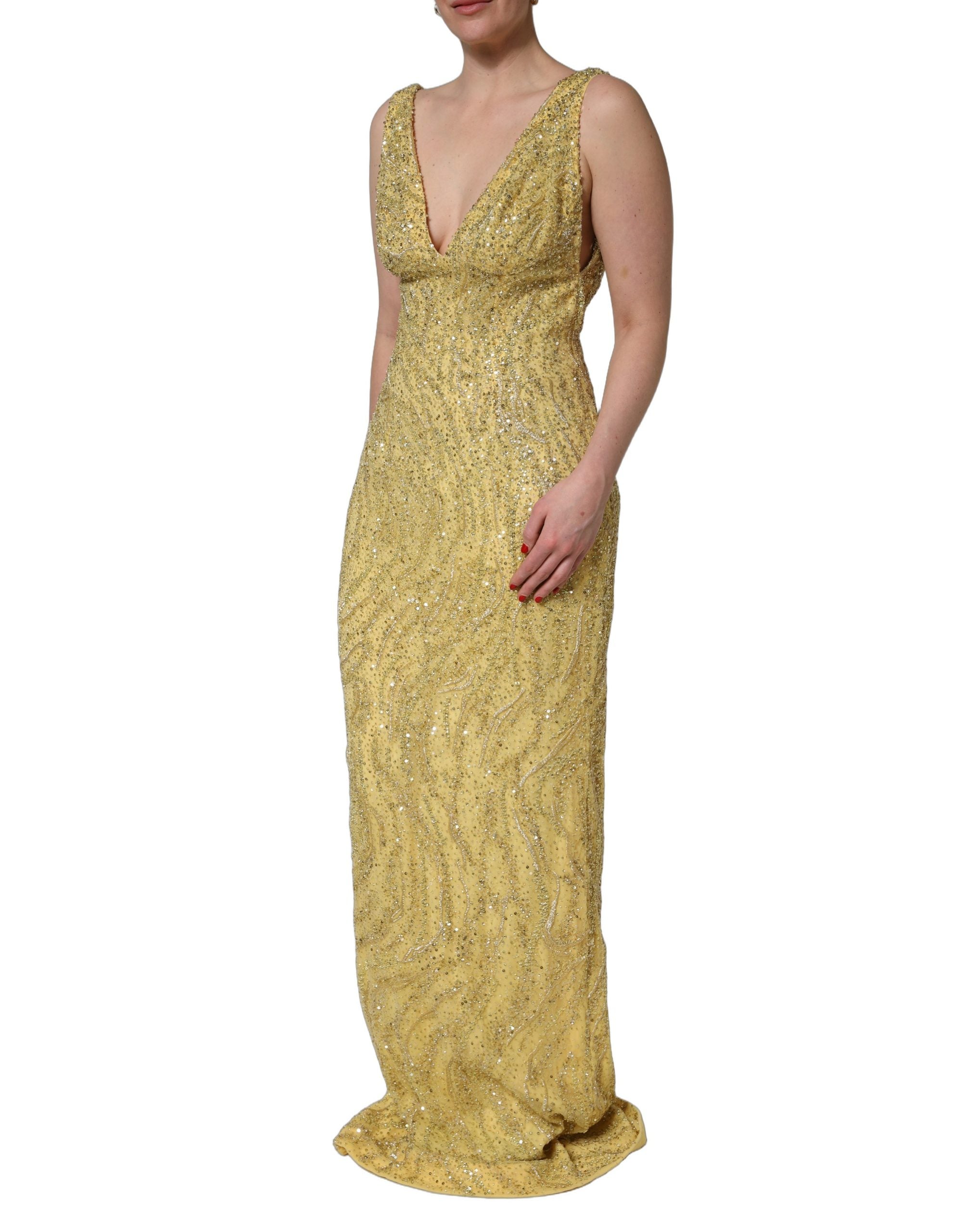 Indulge in the opulent allure of the Dolce & Gabbana Gold V-neckline Mermaid Sequinned Gown, a masterful blend of silk and glass, embodying luxury and elegance for unforgettable moments.