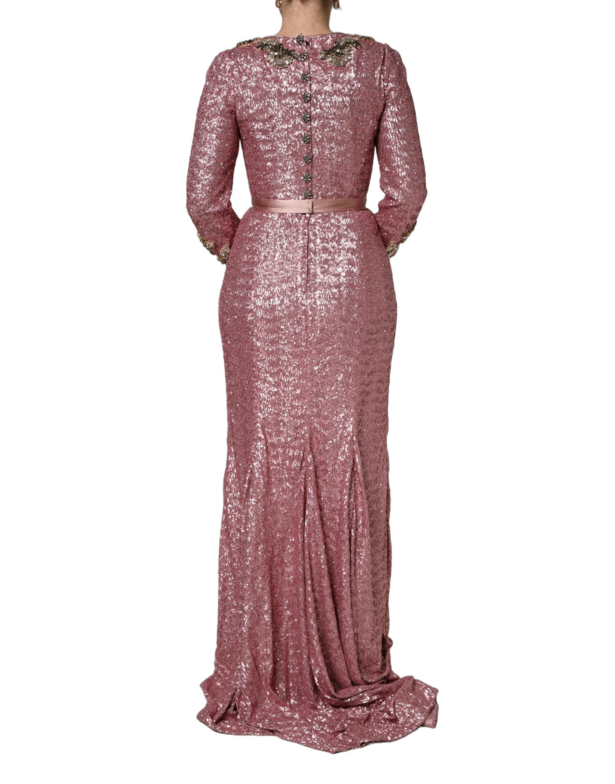 Discover the Dolce & Gabbana Pink Embellished Sequined Evening Gown, a masterpiece of Italian craftsmanship, exuding luxury and allure for unforgettable soirées.