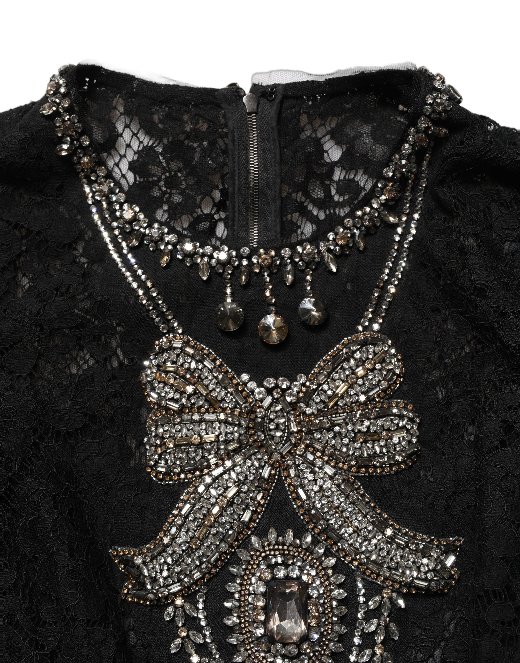 Experience the exquisite allure of the Dolce & Gabbana Black Crystal Embellished Sheath Midi Dress, a masterpiece of Italian craftsmanship that embodies timeless elegance and sophistication.