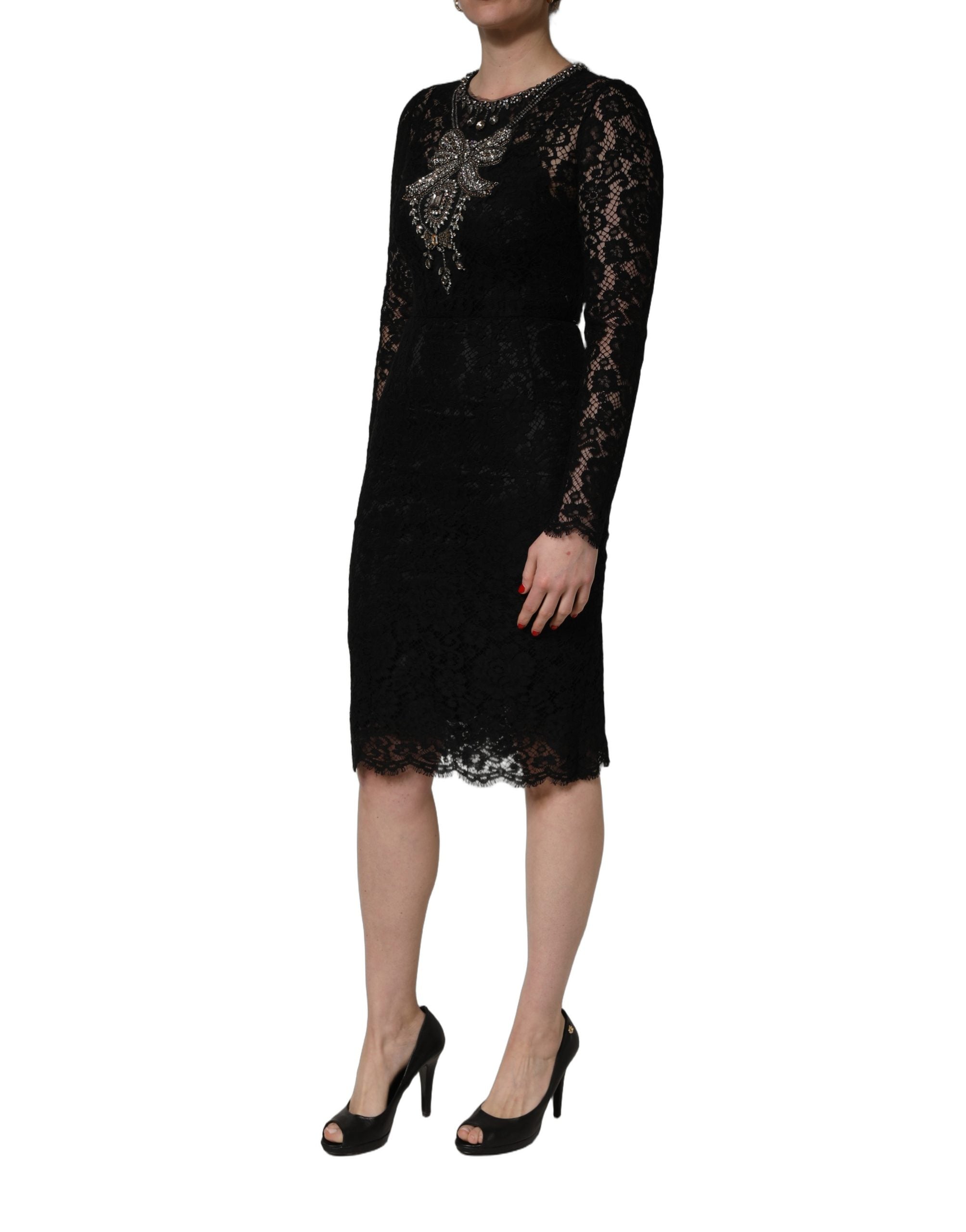 Indulge in the exquisite allure of the Dolce & Gabbana Black Crystal Embellished Sheath Dress, a masterpiece of Italian craftsmanship that embodies timeless elegance and sophistication.