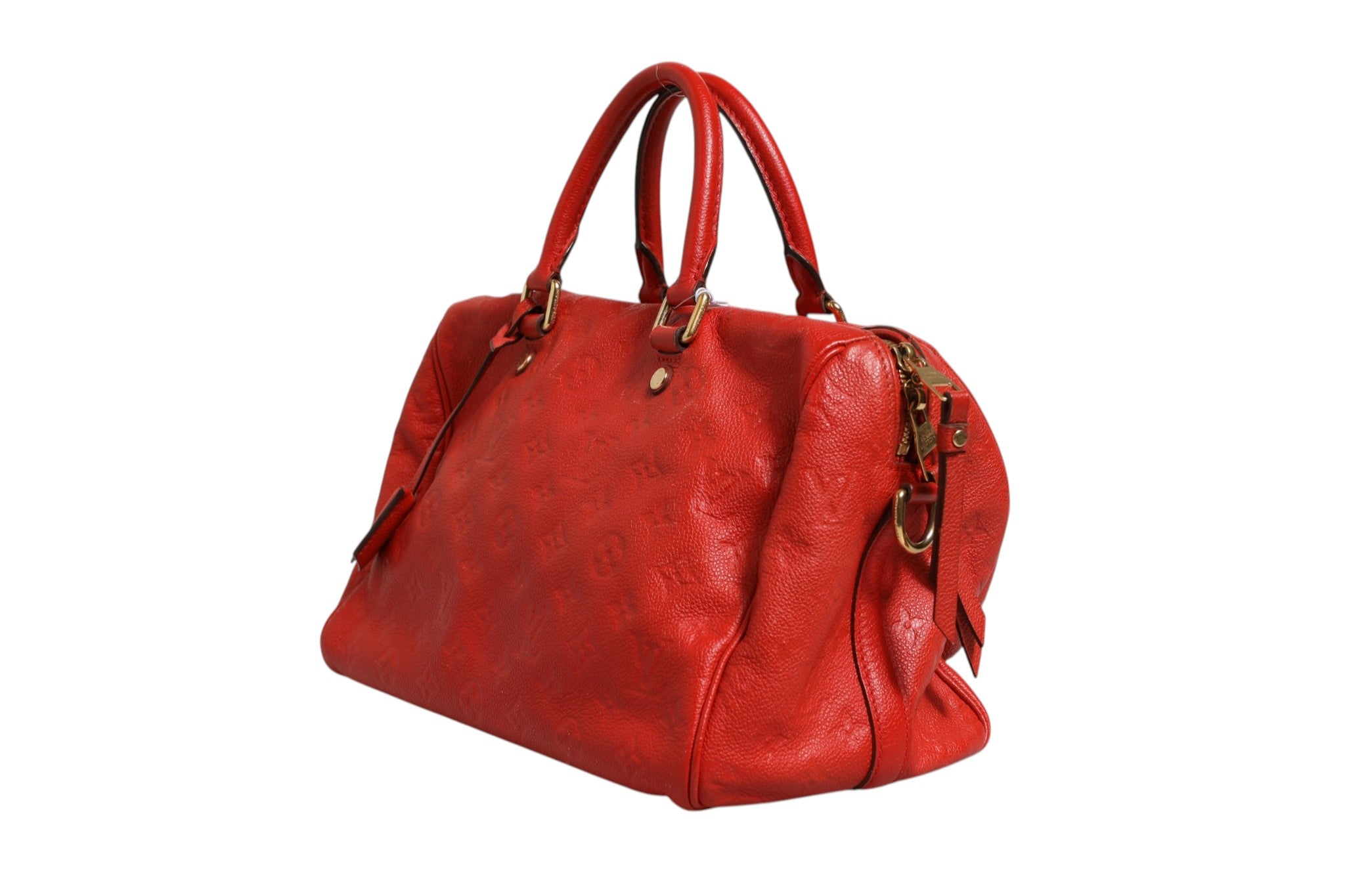 Indulge in the exquisite allure of the Louis Vuitton Red Monogram Empreinte Speedy Bandouliere 30, a timeless masterpiece that embodies luxury and sophistication.