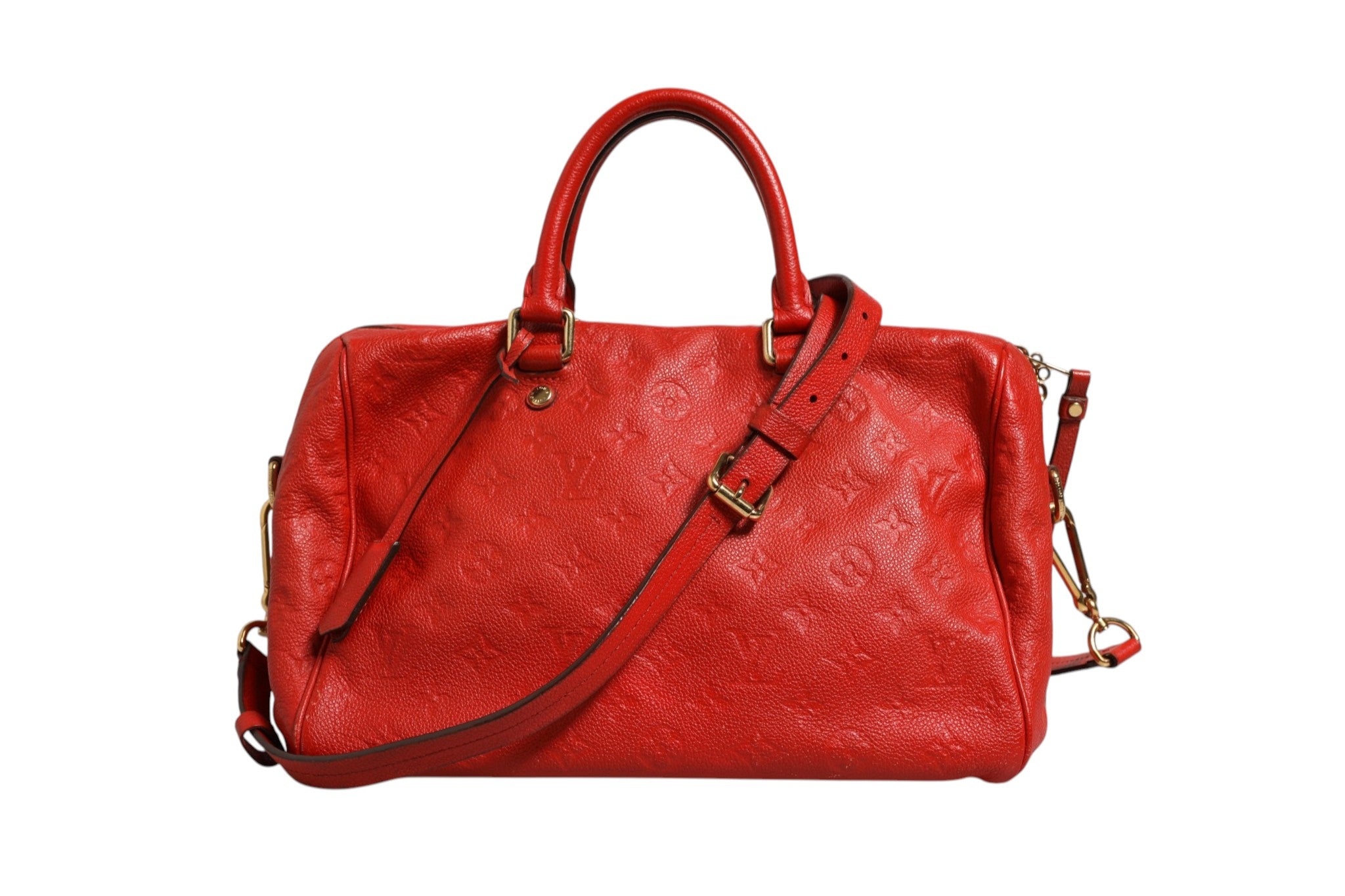 Indulge in the allure of the Louis Vuitton Red Monogram Empreinte Speedy Bandouliere 30, a timeless masterpiece that embodies elegance and sophistication for discerning connoisseurs.