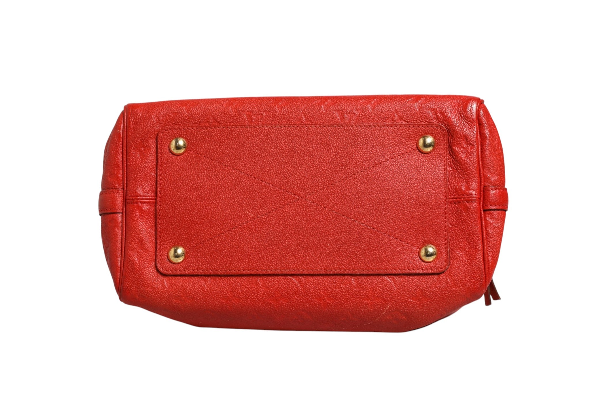 Indulge in the allure of the Louis Vuitton Red Monogram Empreinte Speedy Bandouliere 30, a timeless masterpiece that embodies elegance and sophistication for the discerning connoisseur.