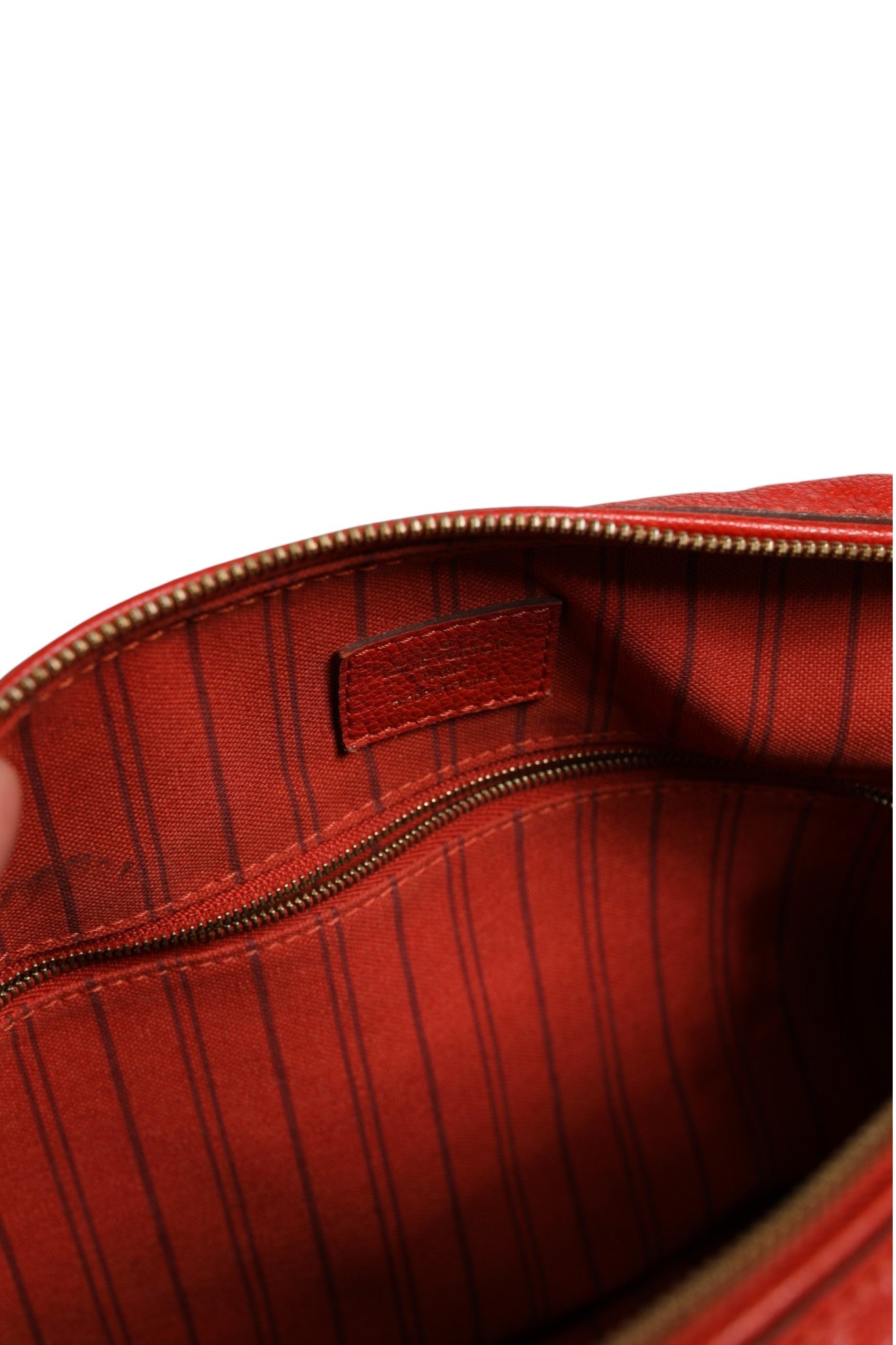Indulge in the timeless elegance of the Louis Vuitton Red Monogram Empreinte Speedy Bandouliere 30, a luxurious embodiment of sophisticated craftsmanship and style.