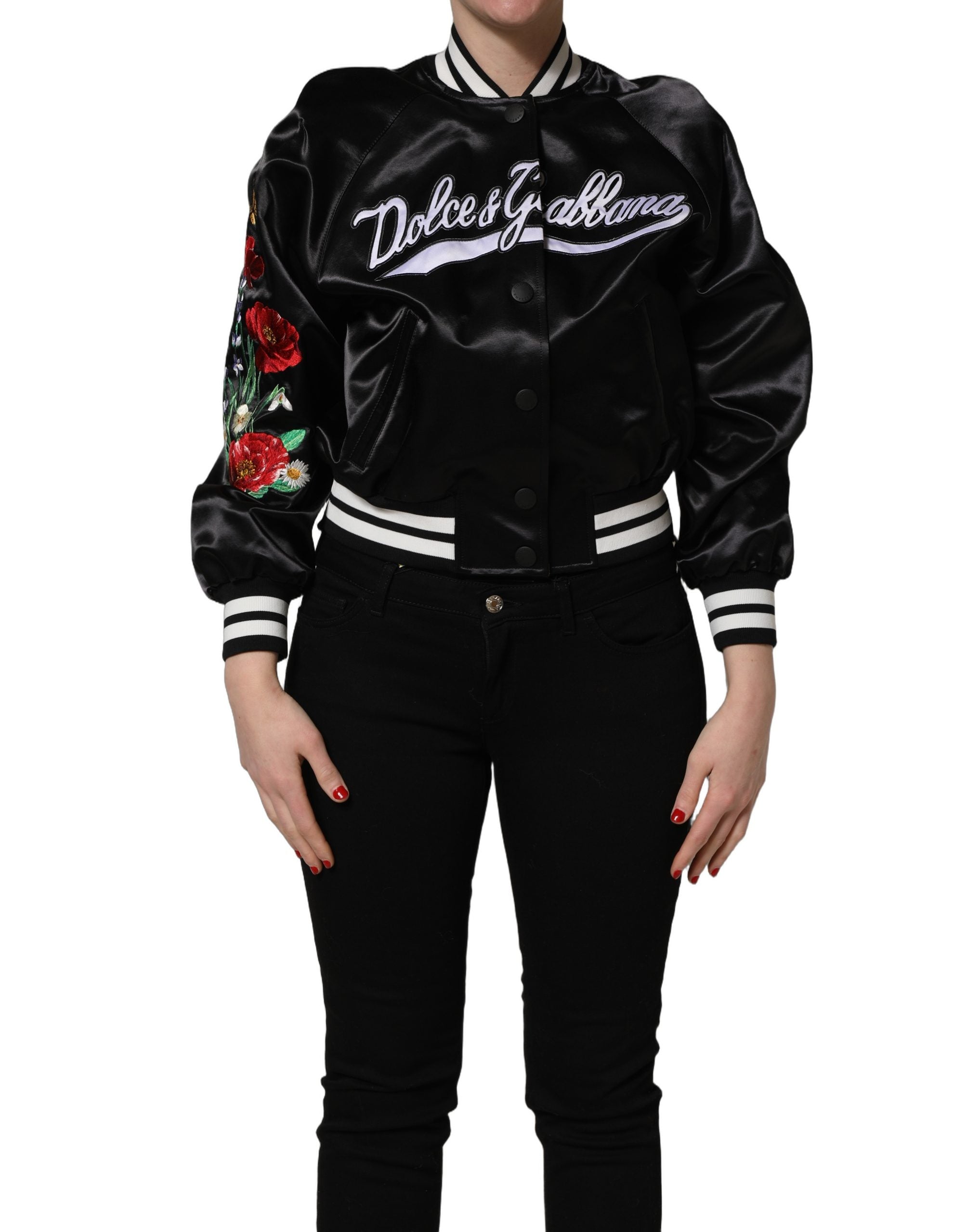 Elevate your wardrobe with the Dolce & Gabbana Black Satin Floral Embroidery Bomber Jacket, a masterpiece of Italian craftsmanship blending sporty elegance with timeless luxury.