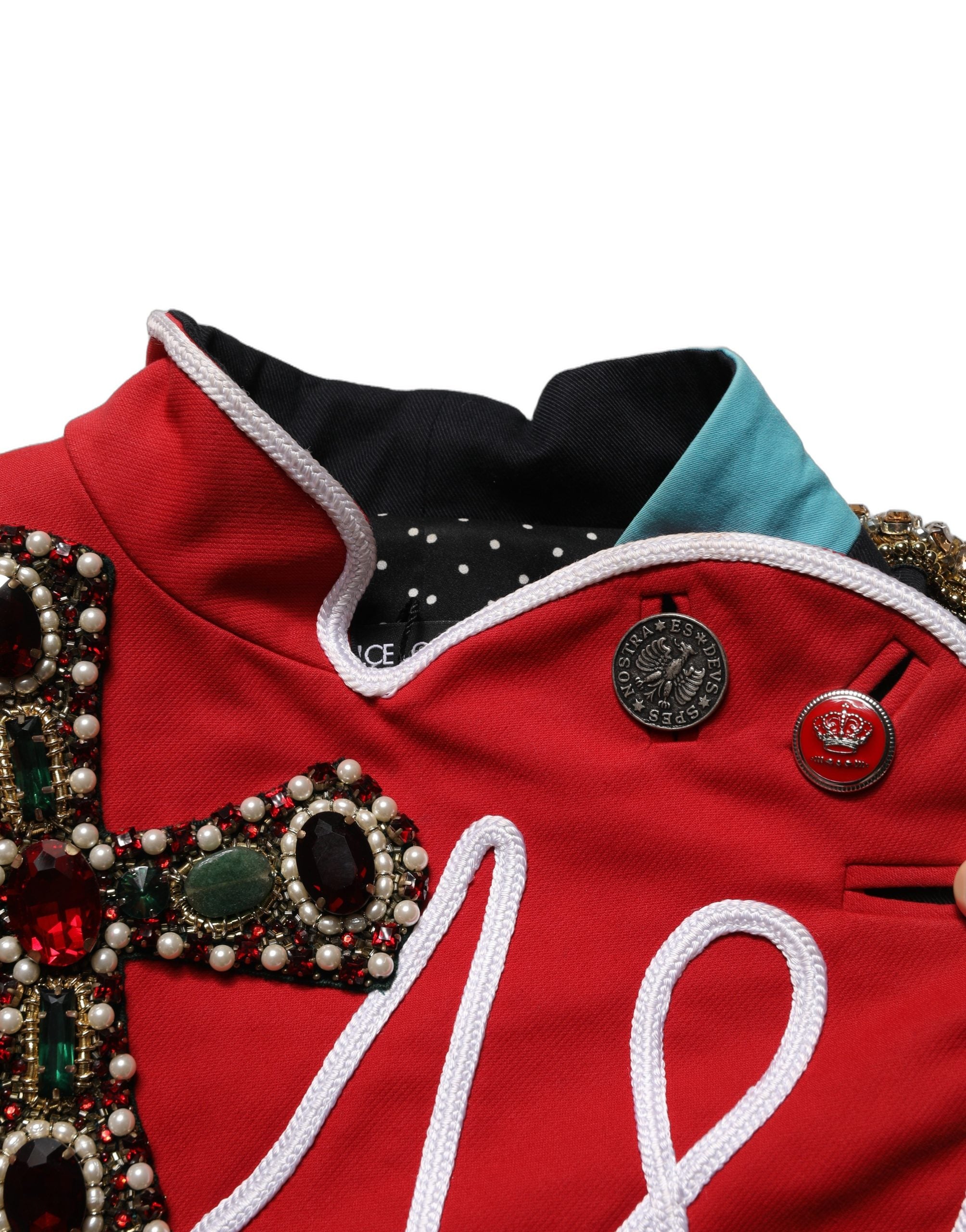 Discover the Dolce & Gabbana Multicolor Asymmetrical Ornate Jewel Cropped Jacket, a masterpiece of Italian craftsmanship that elevates your style with luxurious allure.