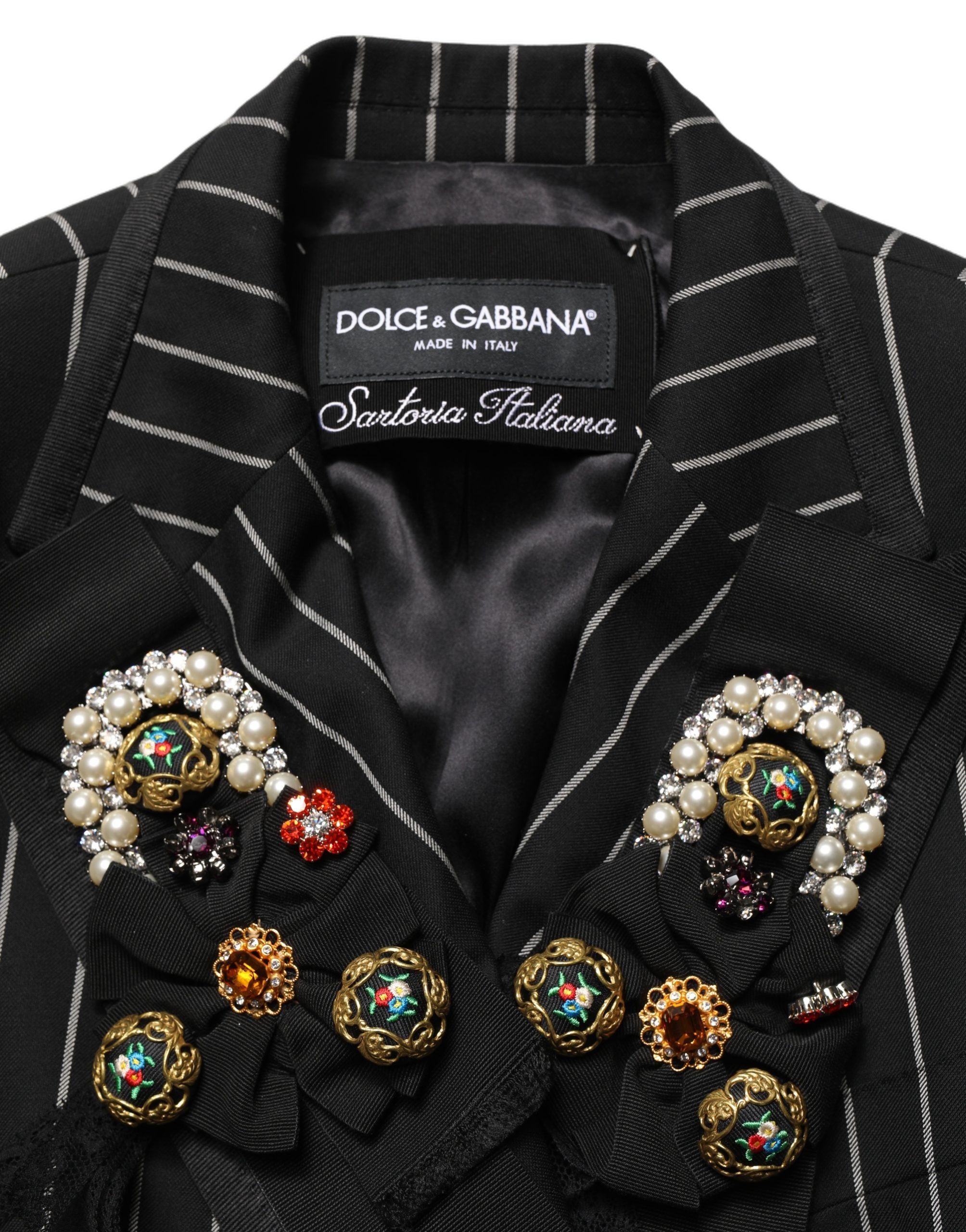 Elevate your wardrobe with the Dolce & Gabbana Black Stripe Double-Breasted Blazer, a masterpiece of luxurious wool and exquisite floral appliqué, embodying timeless sophistication.