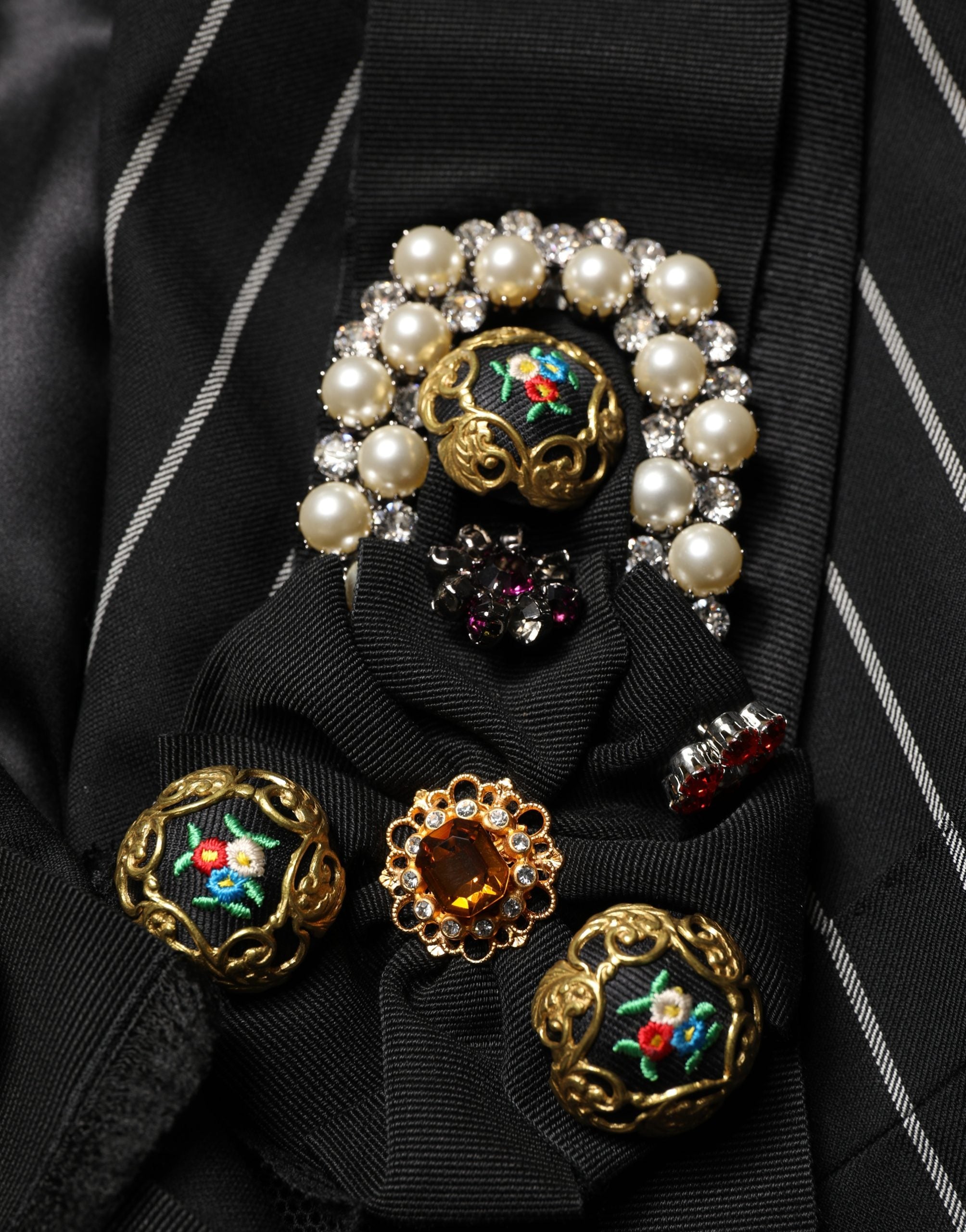 Indulge in the exquisite Dolce & Gabbana Black Stripe Double-Breasted Blazer, a masterpiece of luxurious wool and floral appliqués, perfect for the discerning connoisseur.