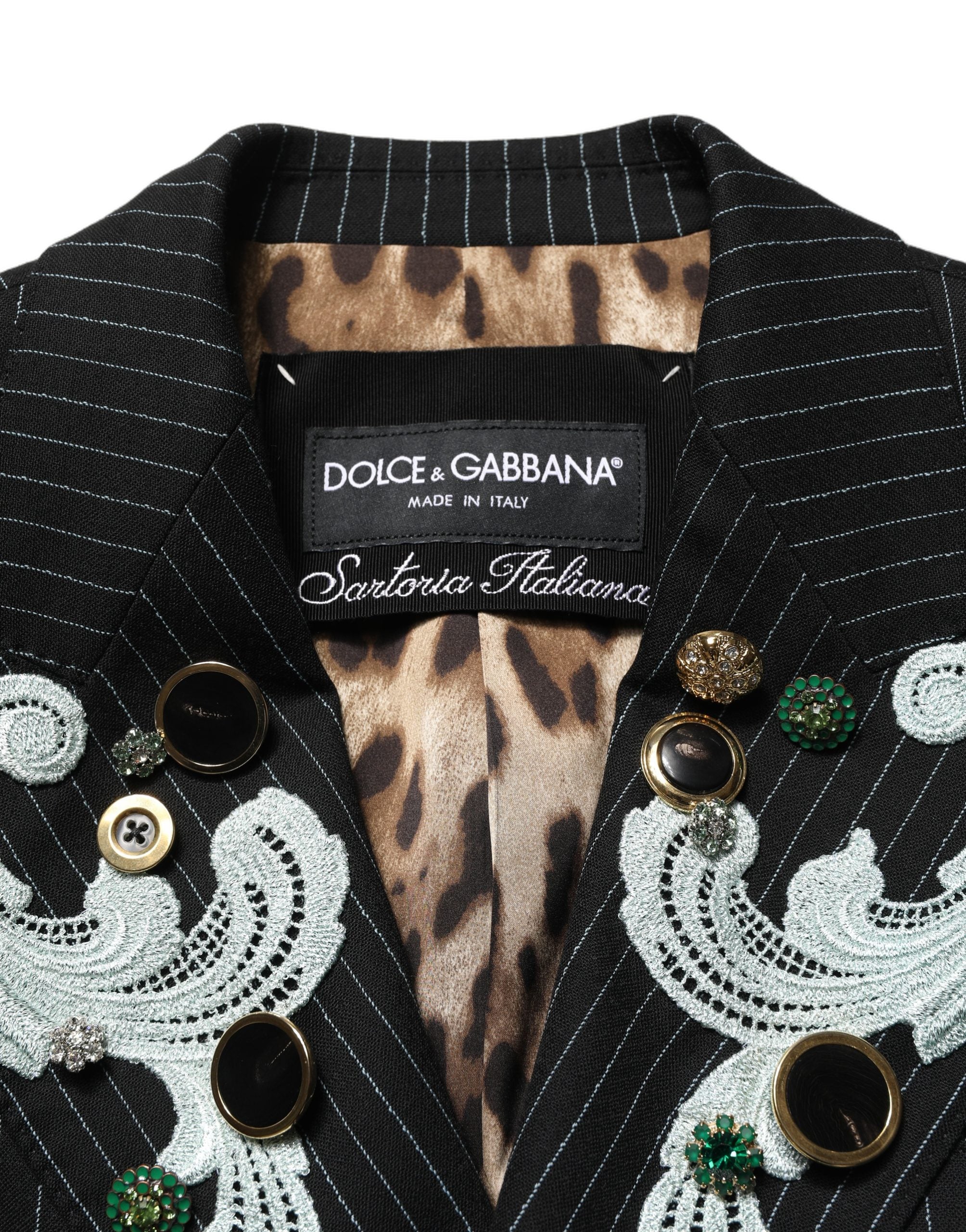 Elevate your wardrobe with the Dolce & Gabbana Black Stripe Double-Breasted Blazer, a luxurious blend of virgin wool and exquisite embroidery, embodying timeless sophistication.