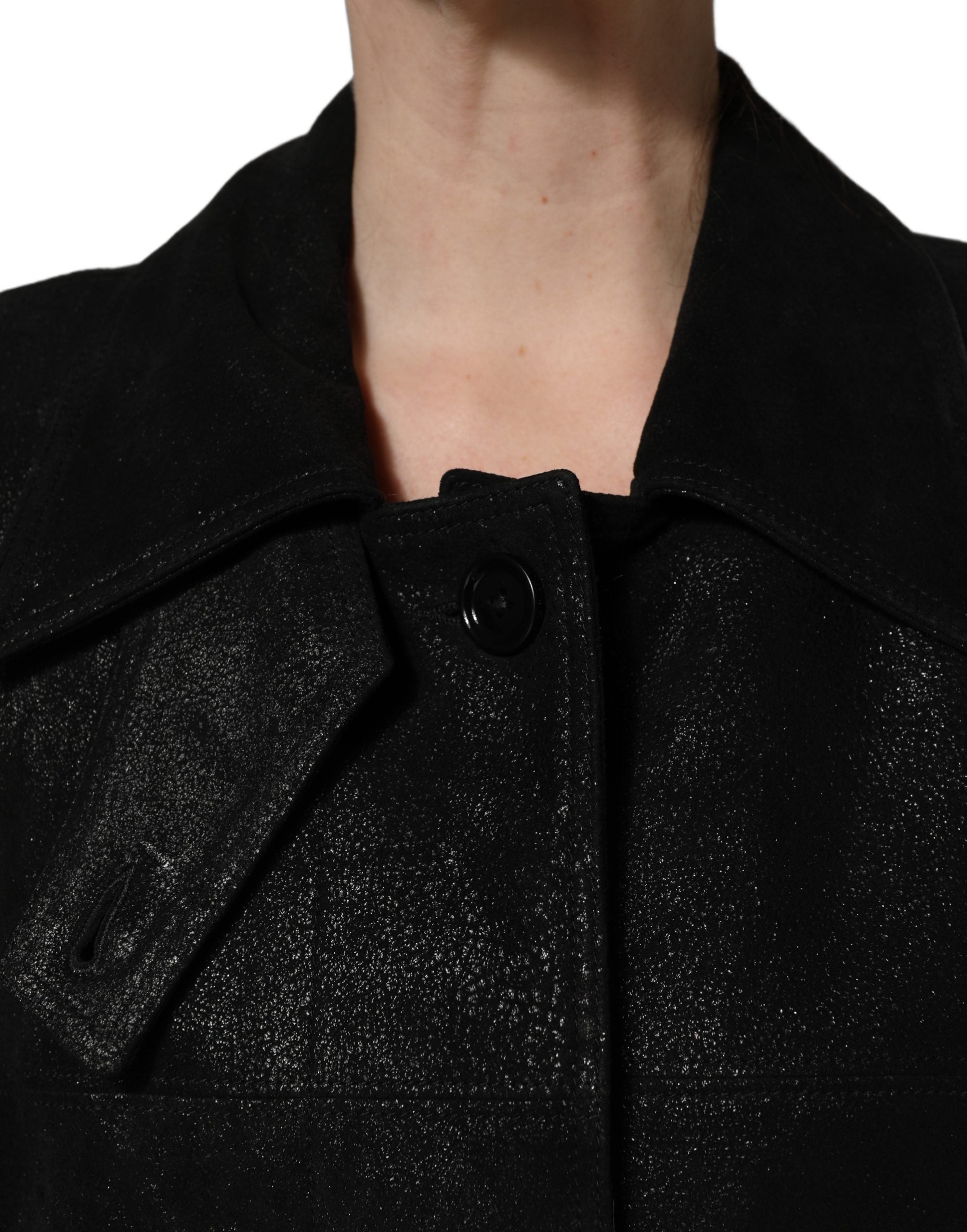 Indulge in the luxurious allure of the Dolce & Gabbana Black Belted Sheepskin Trench Coat, a timeless masterpiece that embodies sophistication and exquisite craftsmanship.