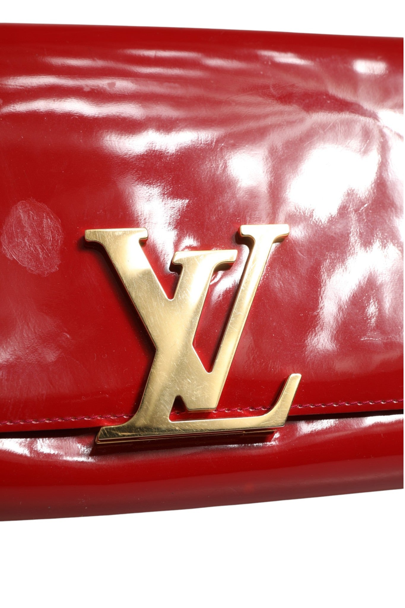 Indulge in the allure of the Louis Vuitton Louise PM Red Patent Leather Wallet On Chain, a masterpiece of craftsmanship that embodies elegance and sophistication for every occasion.