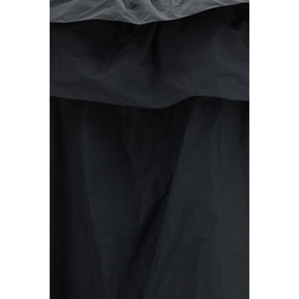 Elevate your wardrobe with the Saint Laurent Black Polyester Casual Dress, a masterpiece of fluid elegance and luxurious craftsmanship, perfect for any sophisticated occasion.