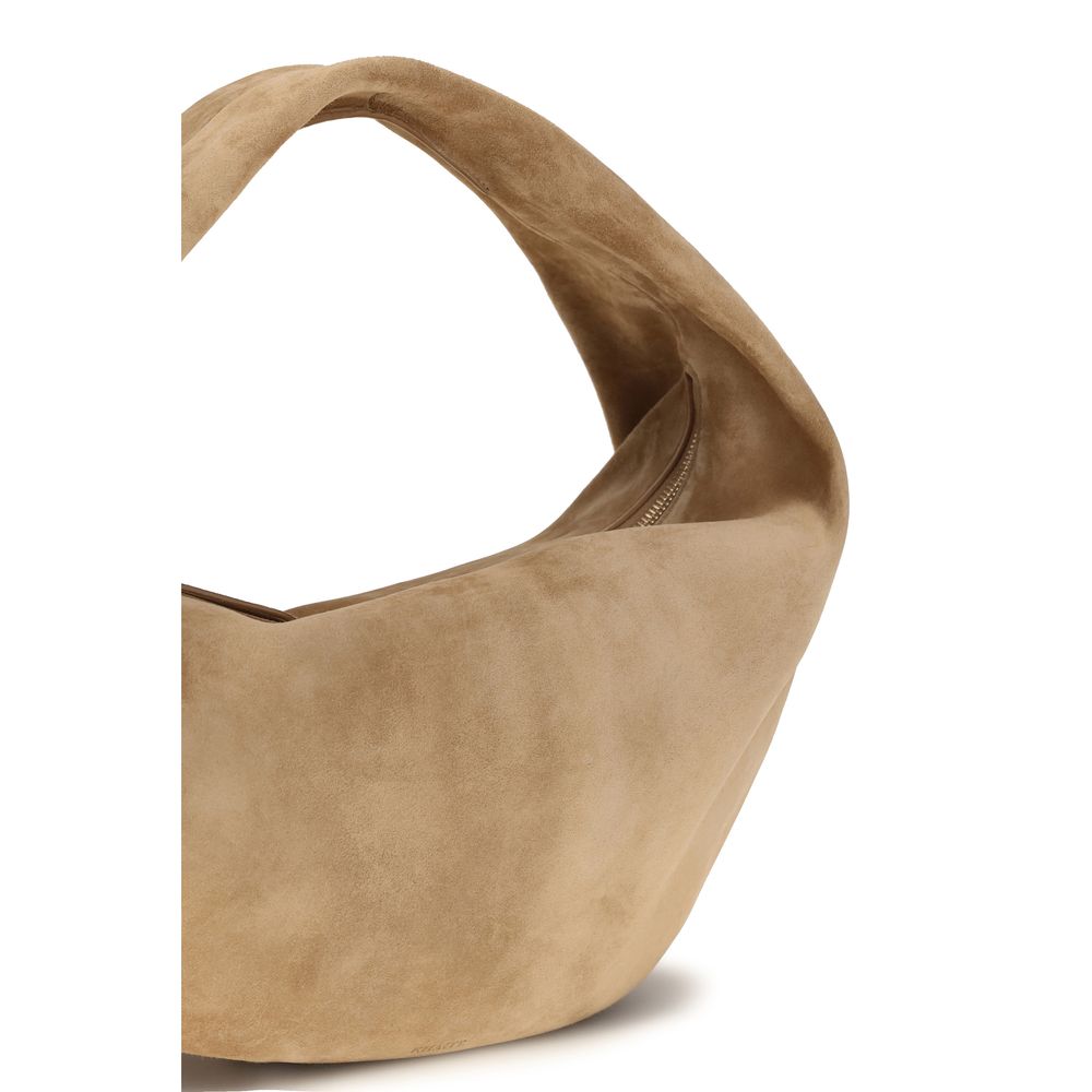 Elevate your style with the Khaite Beige Calf Leather Bos Taurus Shoulder Bag, a masterpiece of luxurious suede, designed for the discerning individual who values refined elegance.