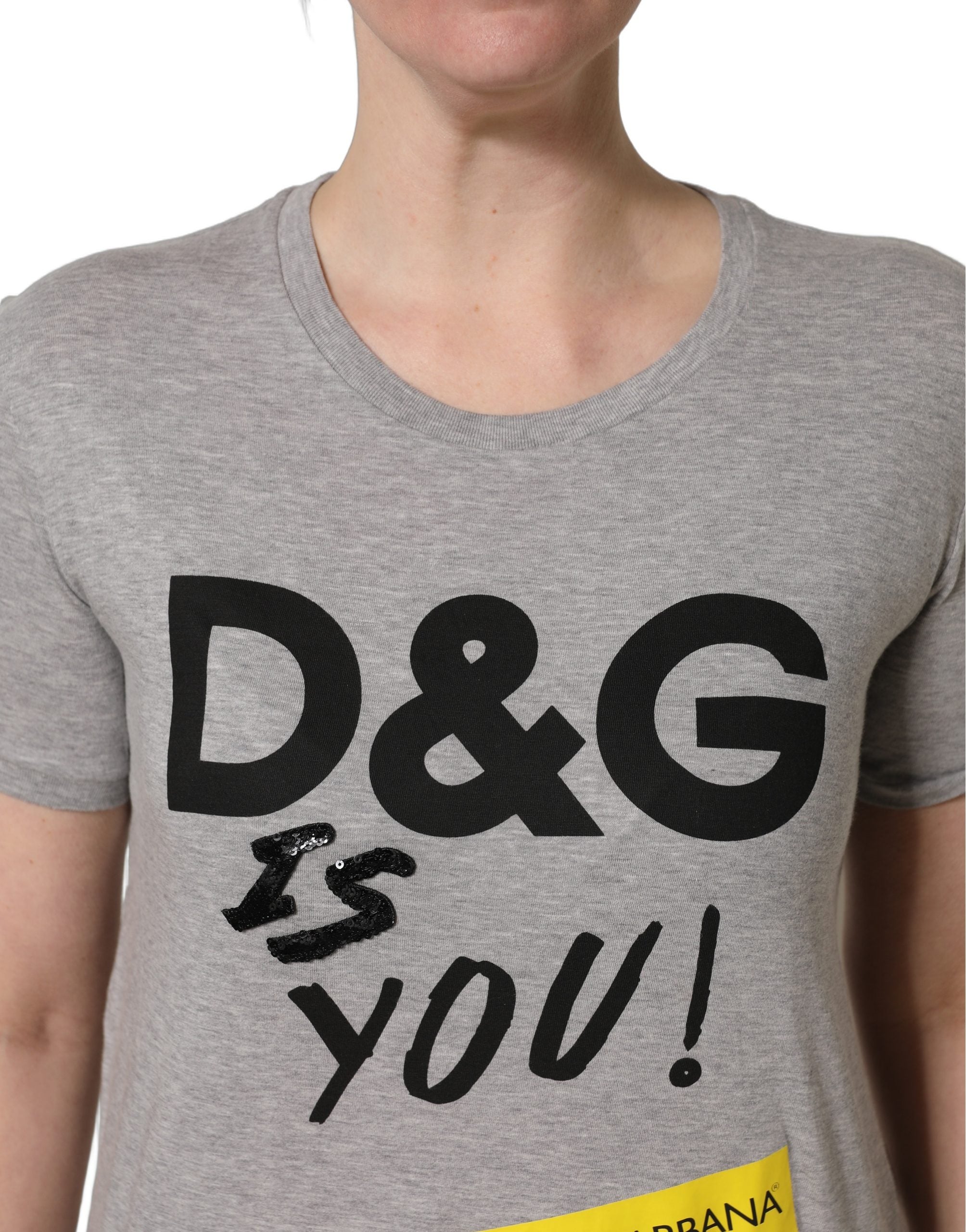 Elevate your wardrobe with the Dolce & Gabbana Gray Cotton Logo Printed Crew Neck T-shirt, a testament to Italian craftsmanship and modern elegance, perfect for the discerning individual.