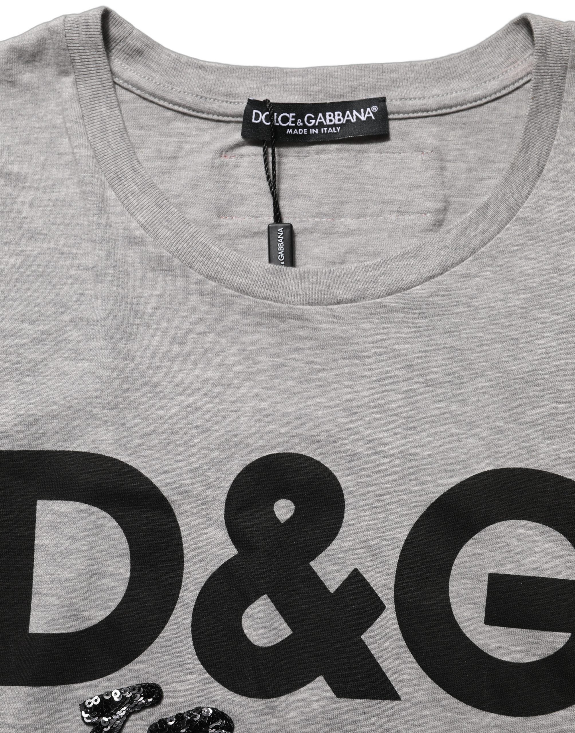 Elevate your wardrobe with the Dolce & Gabbana Gray Cotton Logo Printed Crew Neck T-shirt, a testament to Italian craftsmanship and modern sophistication.
