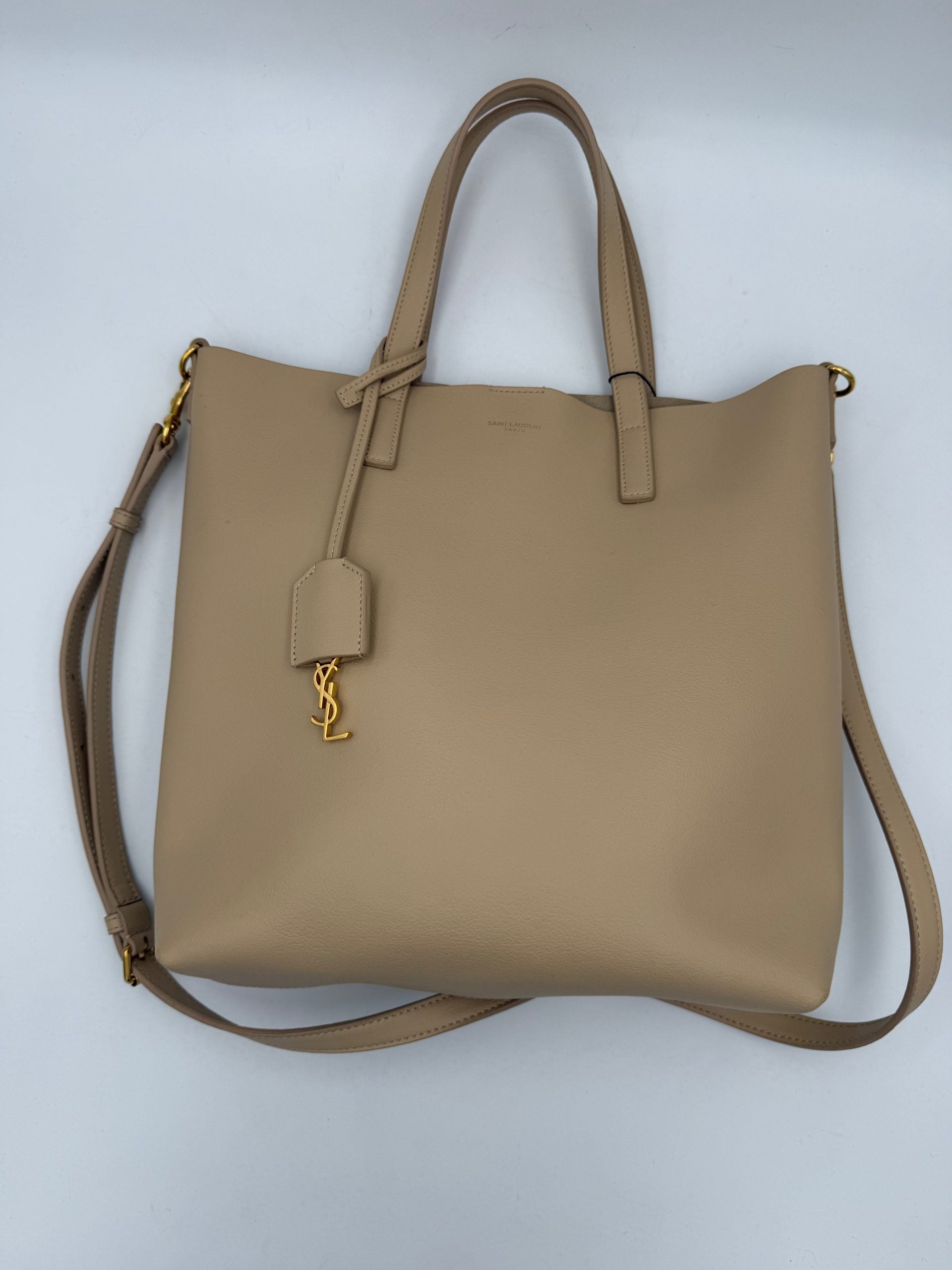 Elevate your style with the Saint Laurent SAINT LAURENT SHOPPING Beige Bag, a masterpiece in fine calf leather, embodying timeless elegance and sophisticated allure.