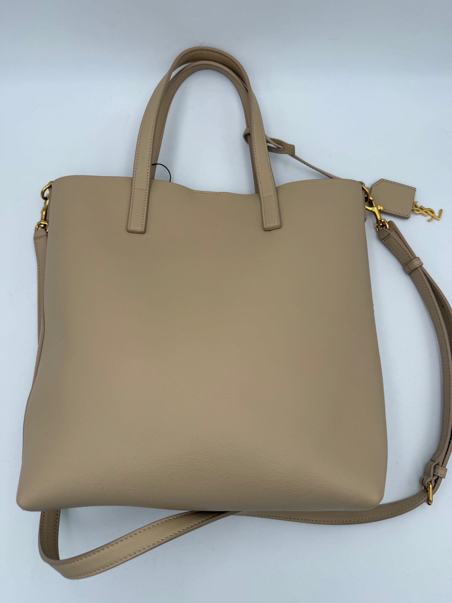 Elevate your style with the Saint Laurent SAINT LAURENT SHOPPING Beige Bag, a masterpiece of fine calf leather and golden accents, embodying timeless elegance and sophistication.