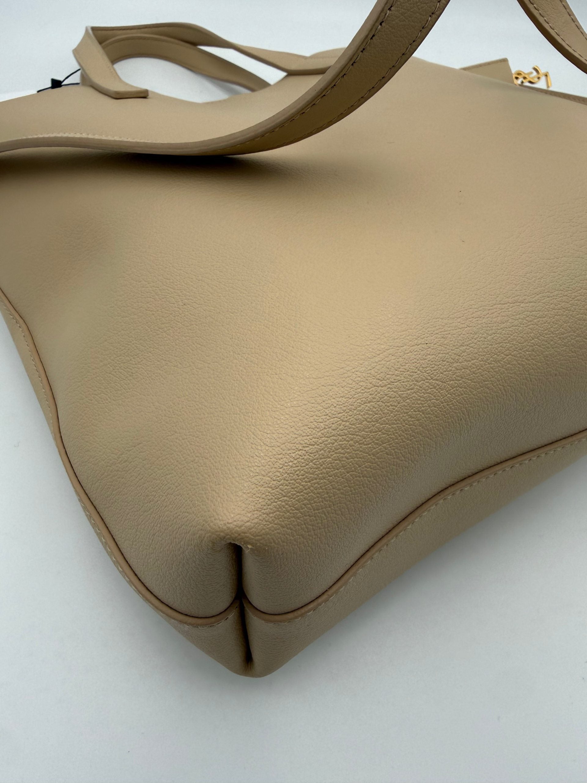 Elevate your style with the Saint Laurent SAINT LAURENT SHOPPING Beige Bag, a masterpiece of fine calf leather and golden accents, embodying timeless luxury and sophistication.