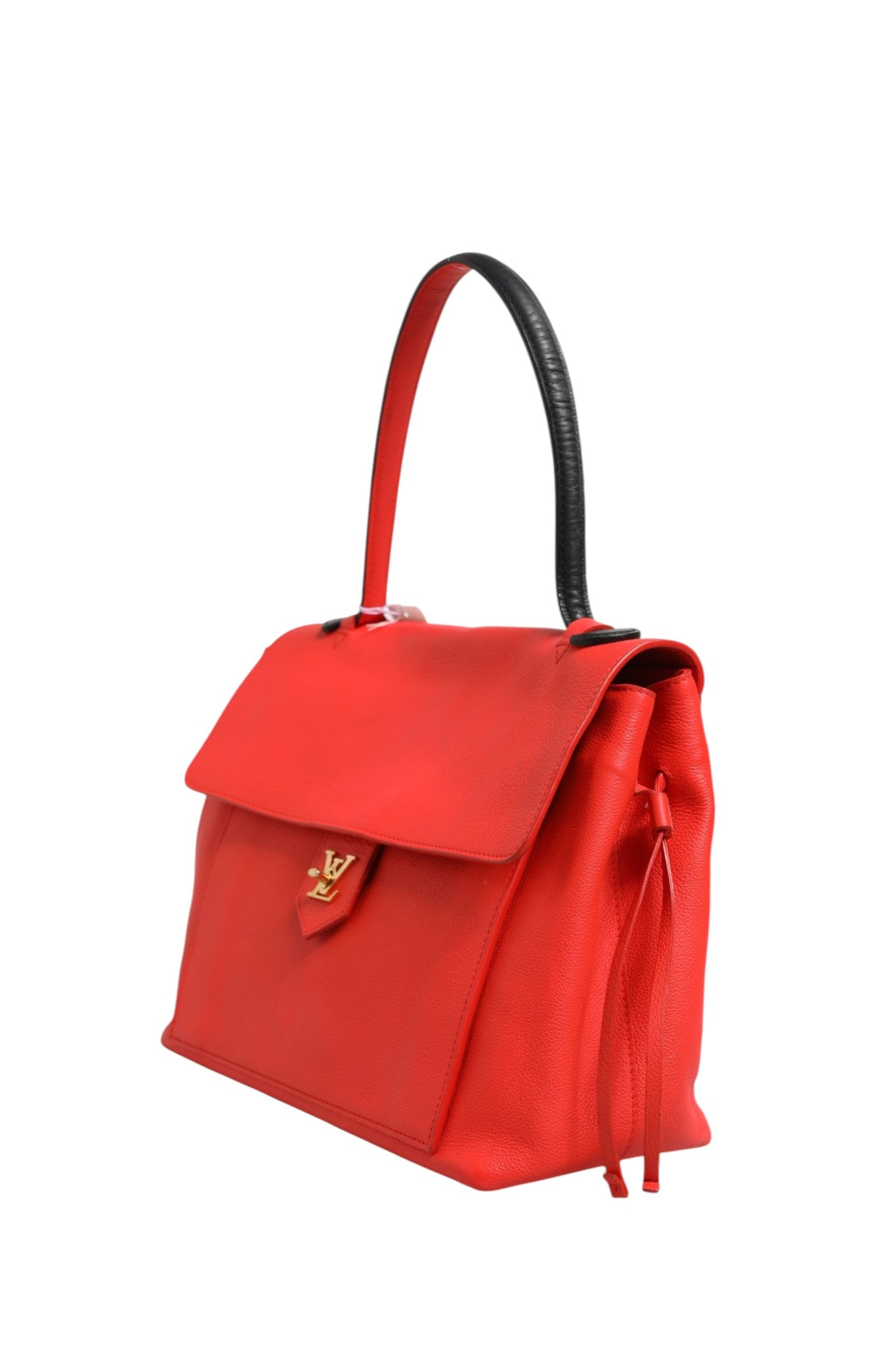 Elevate your style with the Louis Vuitton Lockme Tote Bag, a masterpiece of craftsmanship in vibrant red, embodying timeless luxury and effortless elegance for the discerning individual.