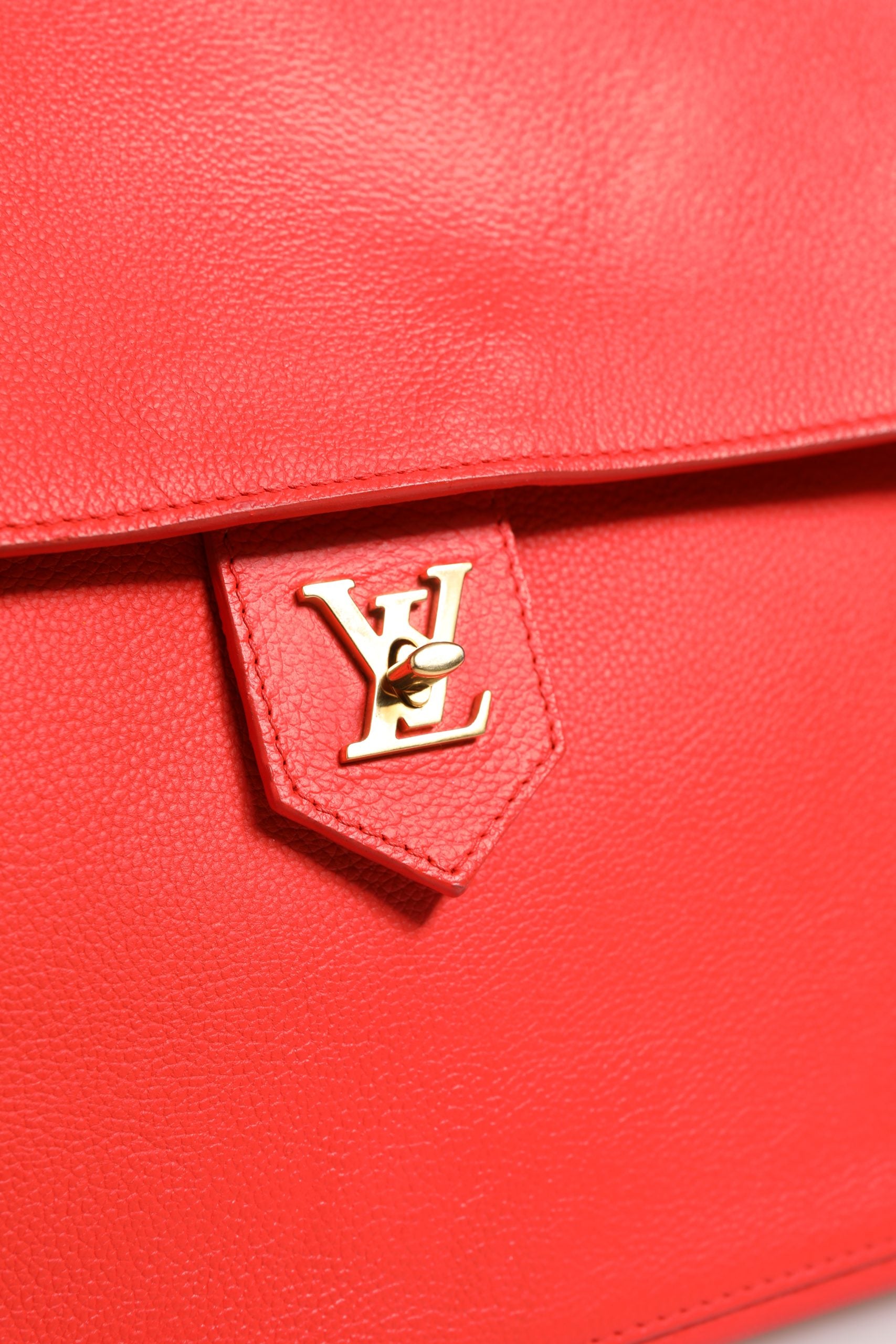 Elevate your collection with the Louis Vuitton Lockme Tote Bag, a masterpiece of red luxury that embodies sophistication and timeless elegance for every occasion.