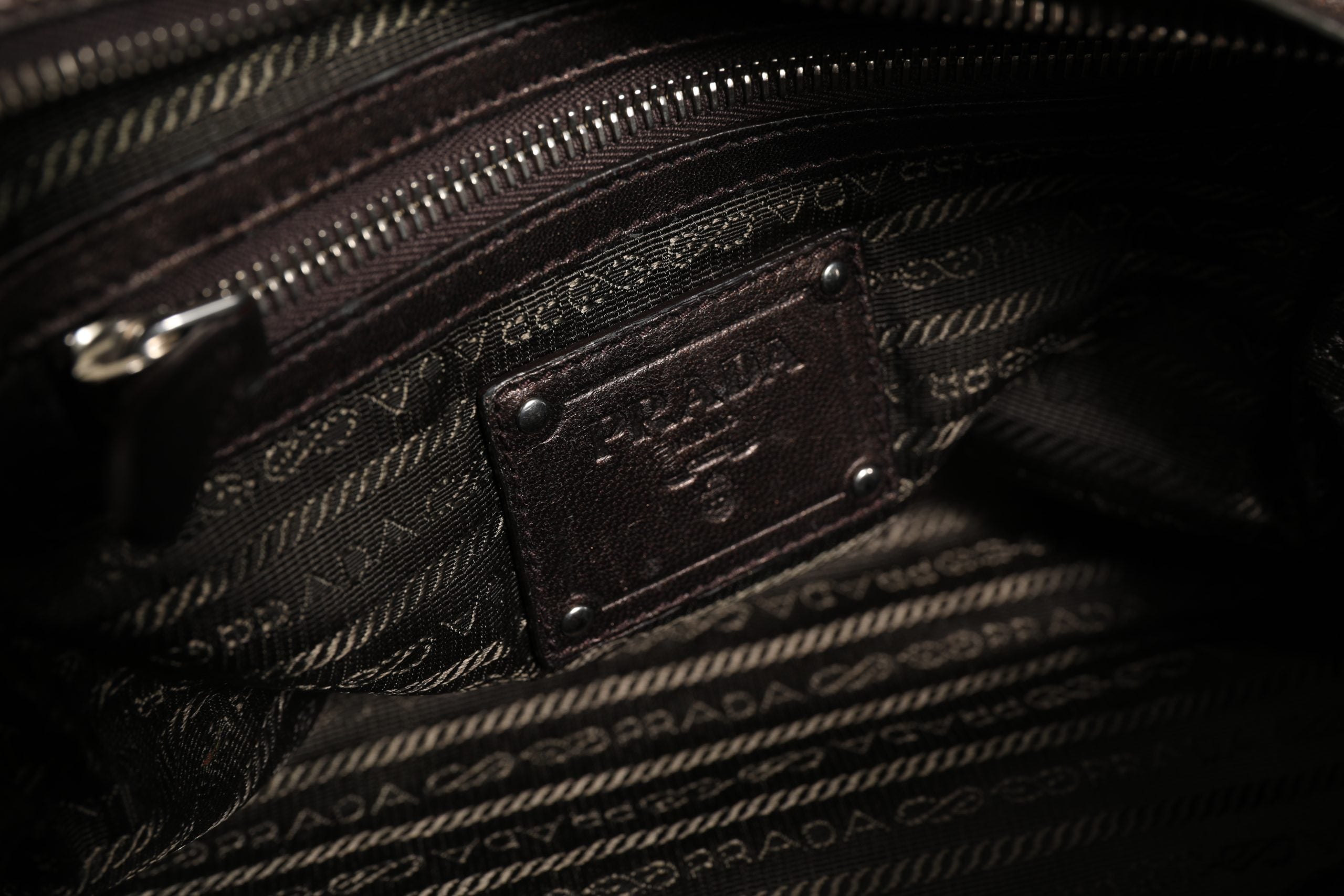 Elevate your elegance with the Prada Metallic Nappa Leather Ruffle Shoulder Bag, a timeless masterpiece of Italian craftsmanship and luxurious allure.