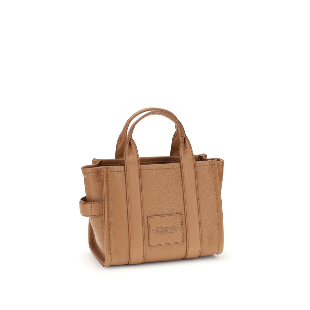 Indulge in the exquisite Marc Jacobs Brown Calf Leather Bos Taurus Handbag, a testament to artisanal luxury and timeless elegance, perfect for the discerning individual.