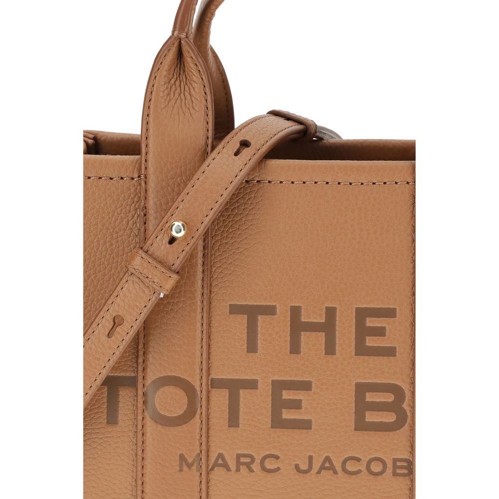 Discover the Marc Jacobs Brown Calf Leather Bos Taurus Handbag, a masterpiece of artisanal luxury, blending exquisite materials with timeless elegance for the discerning individual.