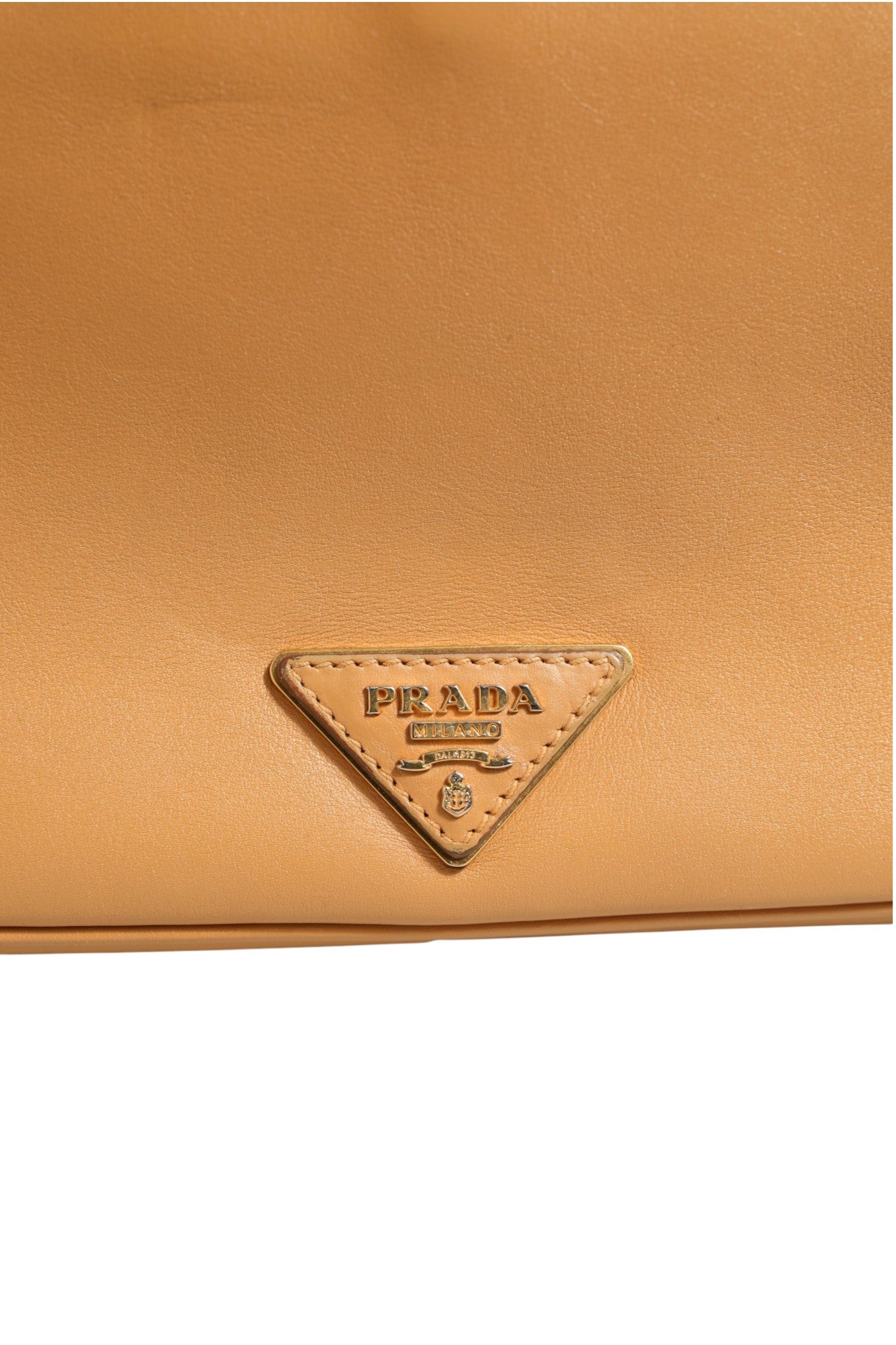 Elevate your style with the Prada Sidonie Beige Pebble Leather Shoulder Bag, a symbol of refined craftsmanship and timeless elegance, perfect for any sophisticated occasion.