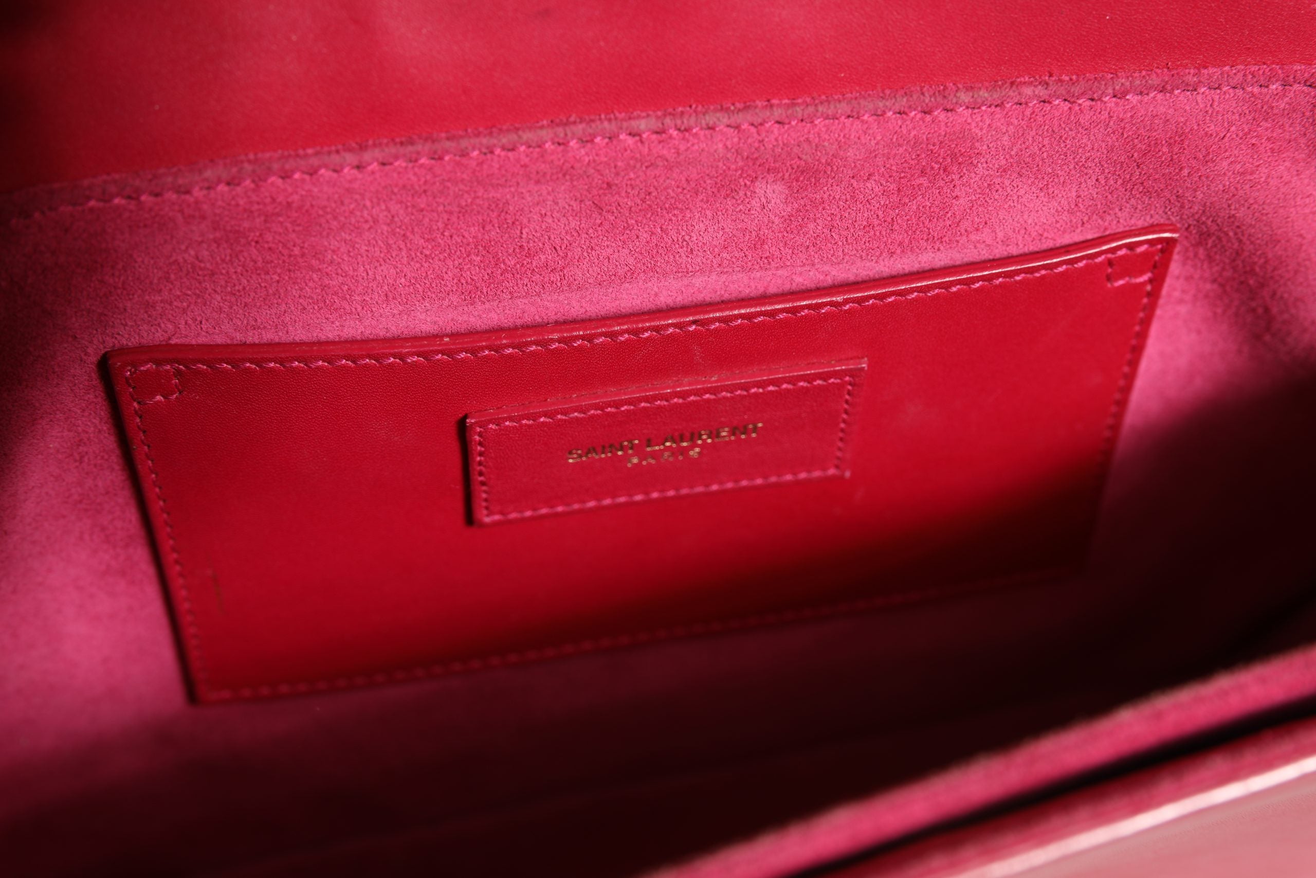 Discover the Saint Laurent Loulou Handbag, a masterpiece of pink leather elegance, embodying timeless luxury and sophistication for the discerning individual.