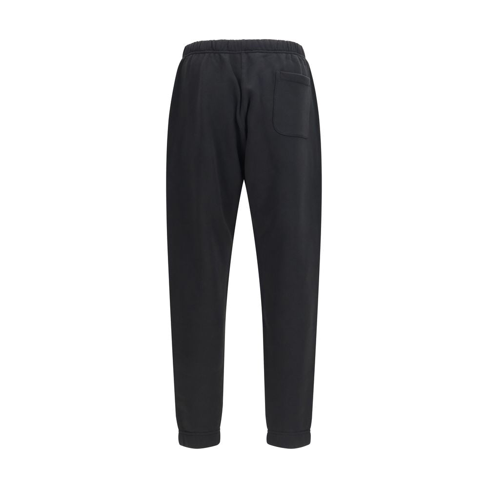 Elevate your wardrobe with Kenzo Black Cotton Joggers, a luxurious blend of soft cotton and sophisticated design, perfect for the discerning individual seeking effortless elegance.