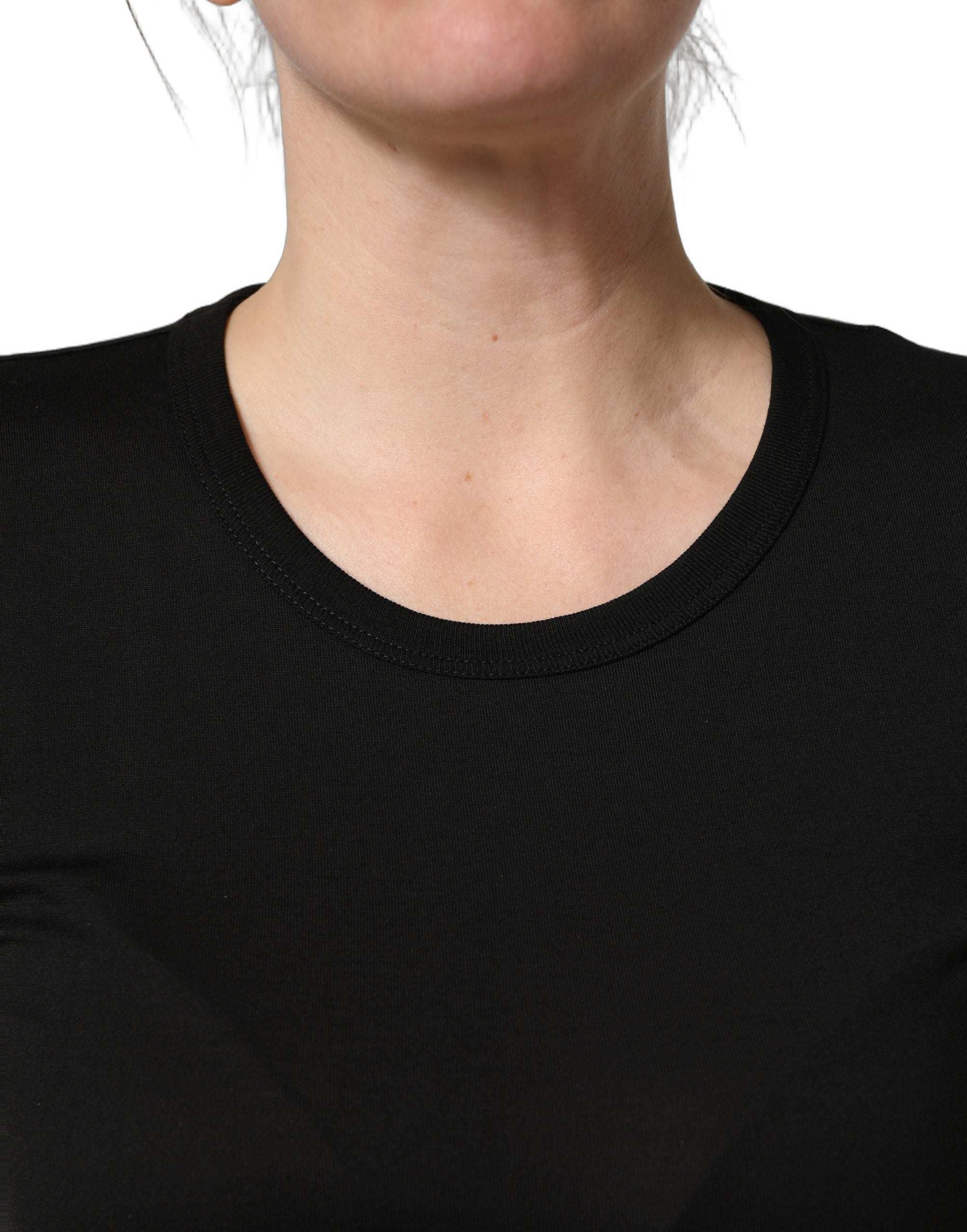 Elevate your wardrobe with the Dolce & Gabbana Black Cotton Round Neck T-shirt, a luxurious staple crafted in Italy, blending timeless elegance with modern sophistication.