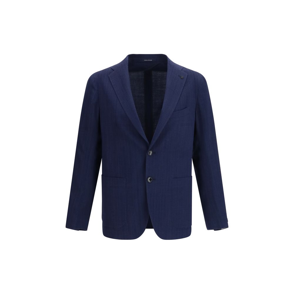 Elevate your style with the Tagliatore Blue Wool Oves Aries Blazer, a masterpiece of refined herringbone fabric, embodying timeless luxury and sophisticated elegance.